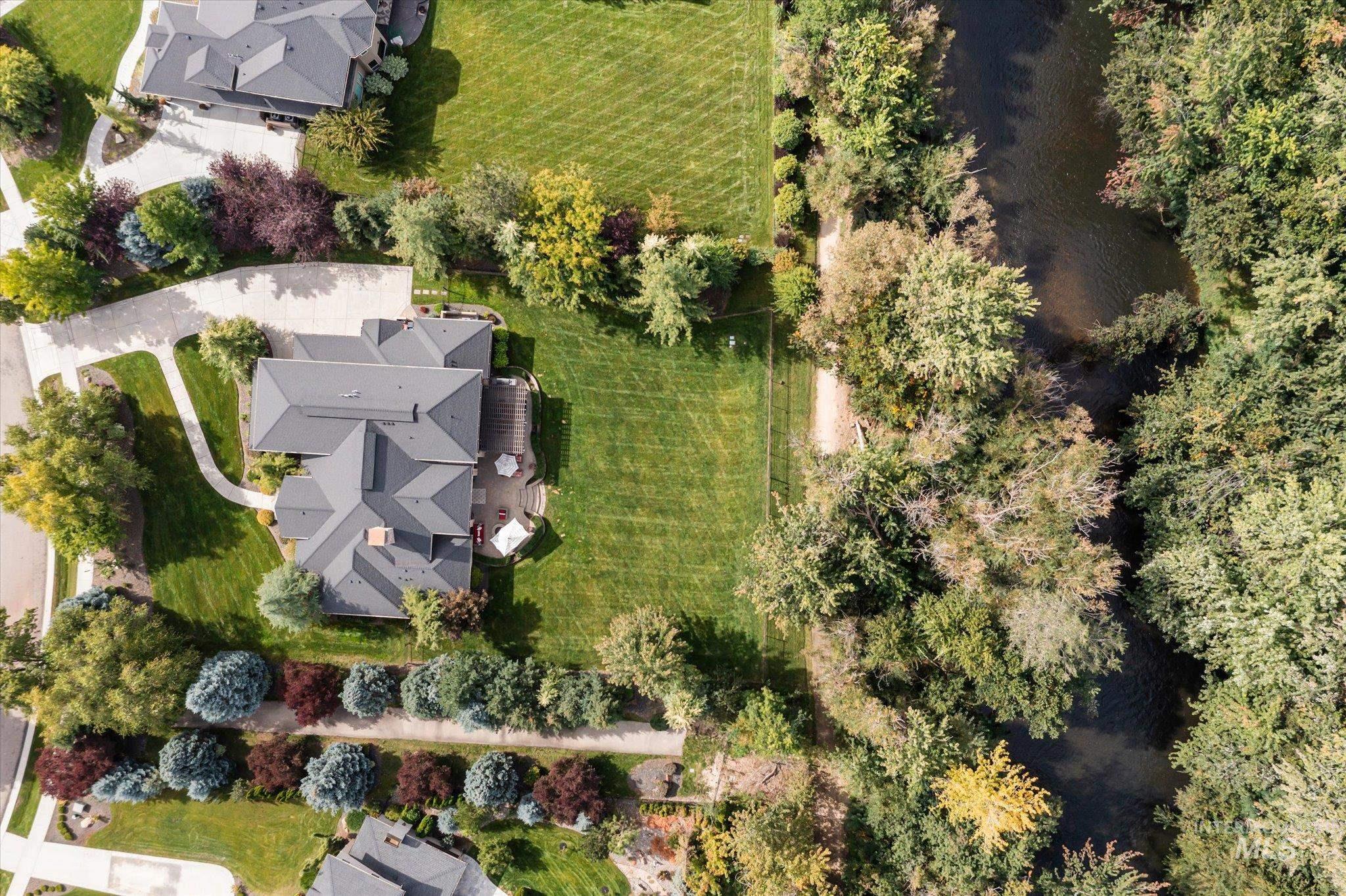 Aerial overview of property's location with a large body of water