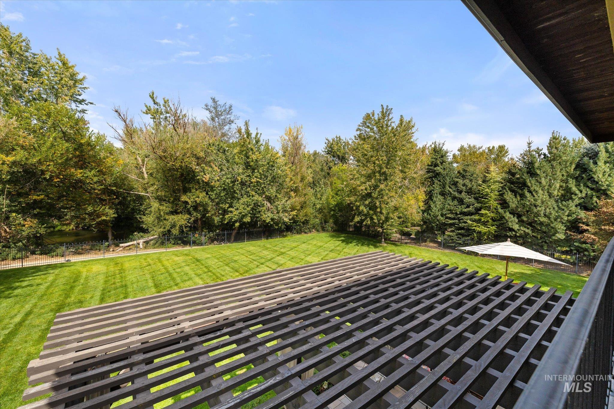 Patio / terrace with view of scattered trees