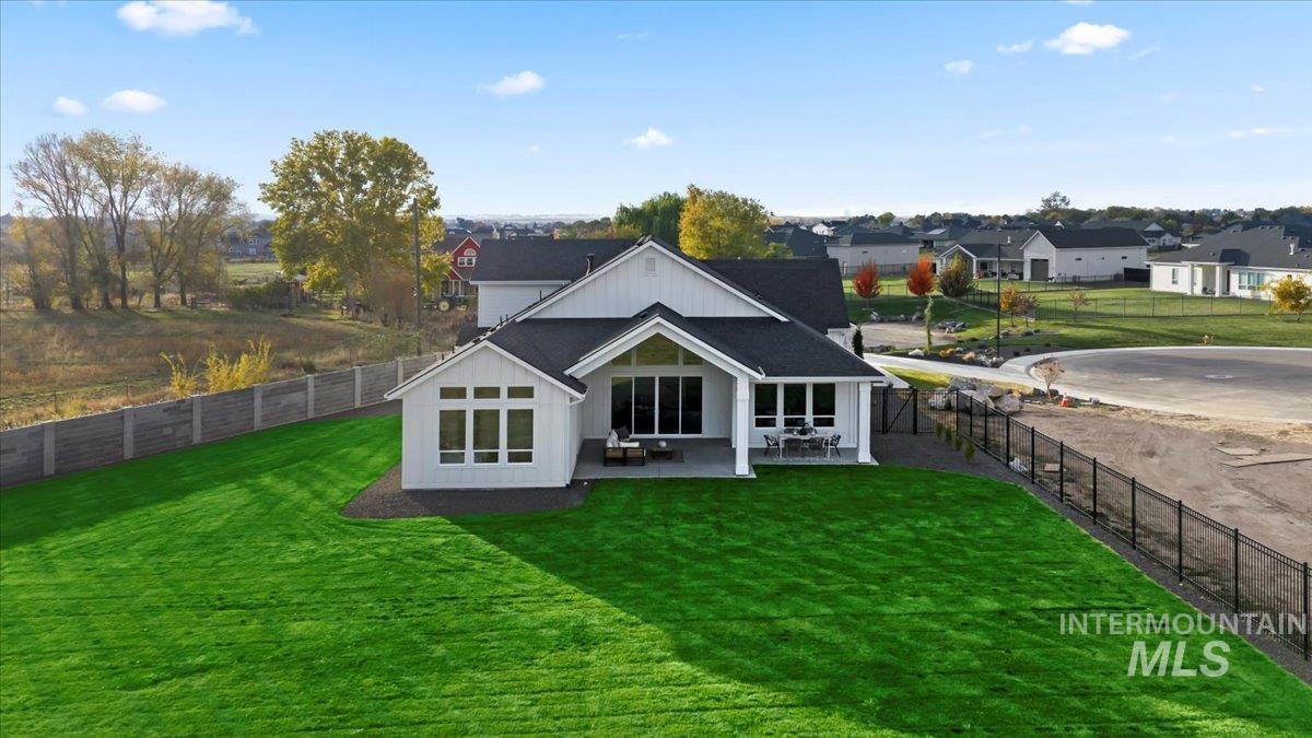 Back of house featuring a patio and a fenced backyard