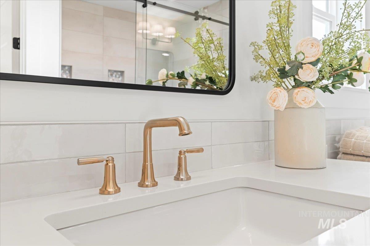 Bathroom view of backsplash and vanity