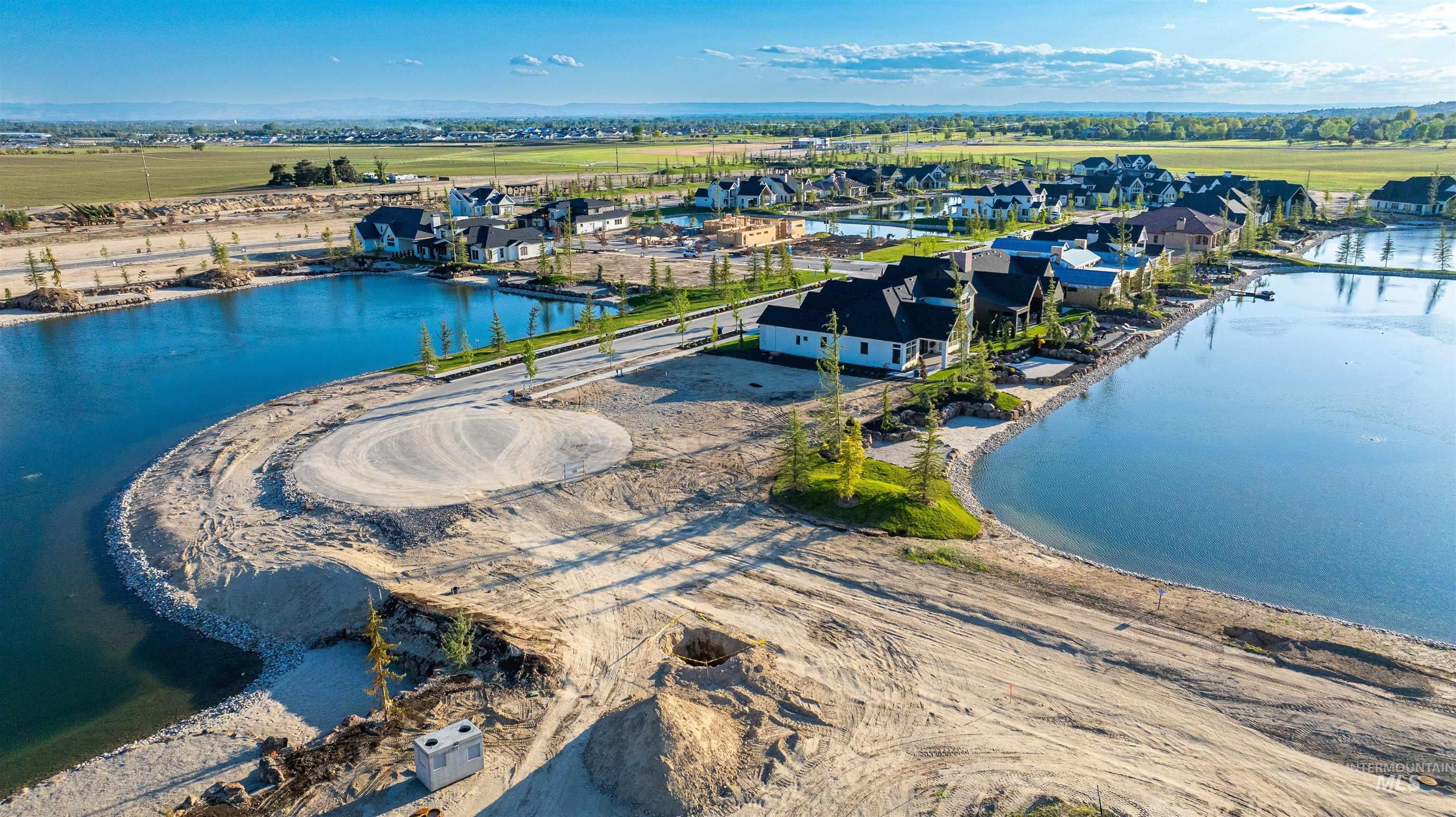 Aerial perspective of suburban area with a large body of water