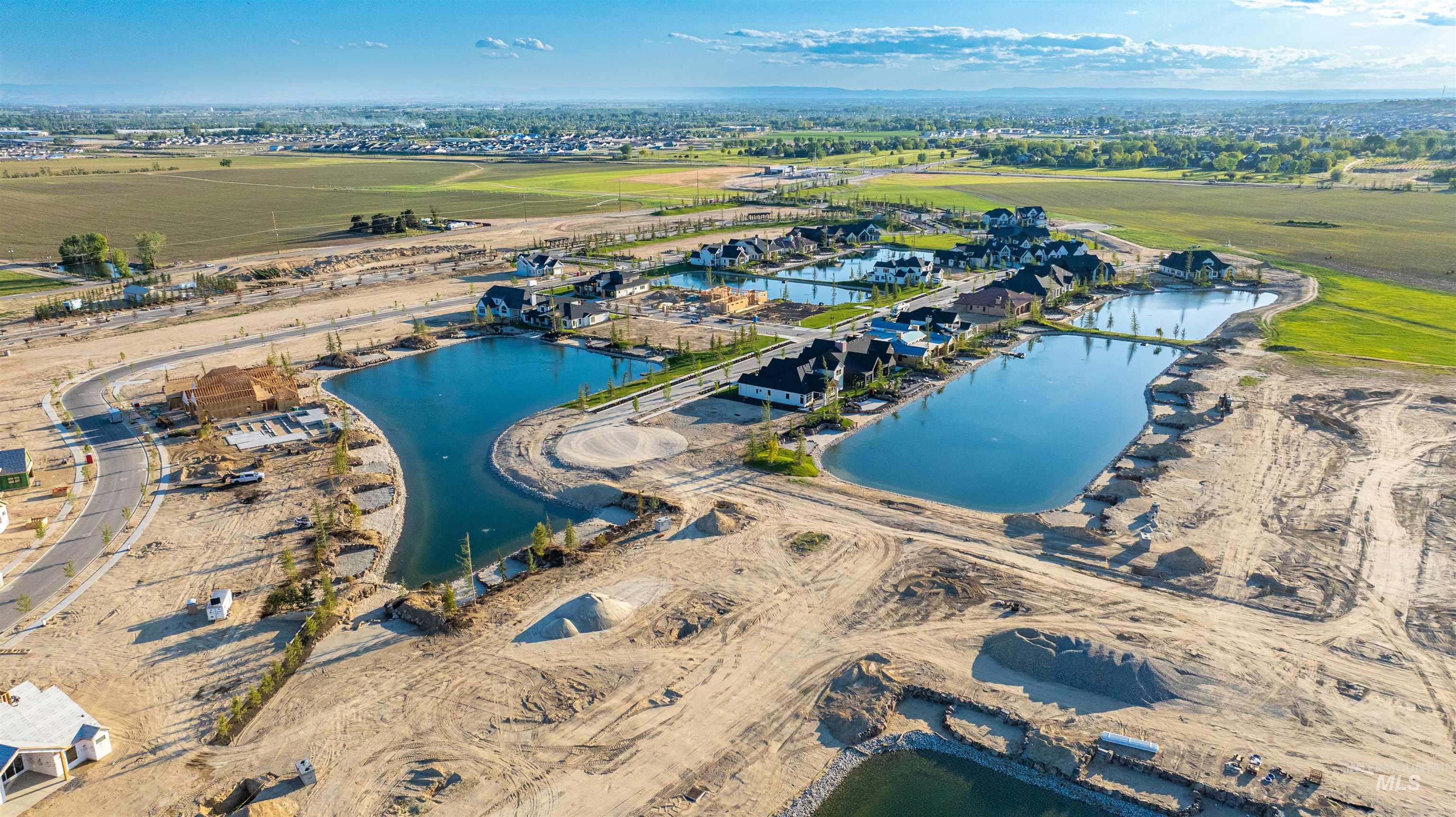 Aerial overview of property's location with a nearby body of water
