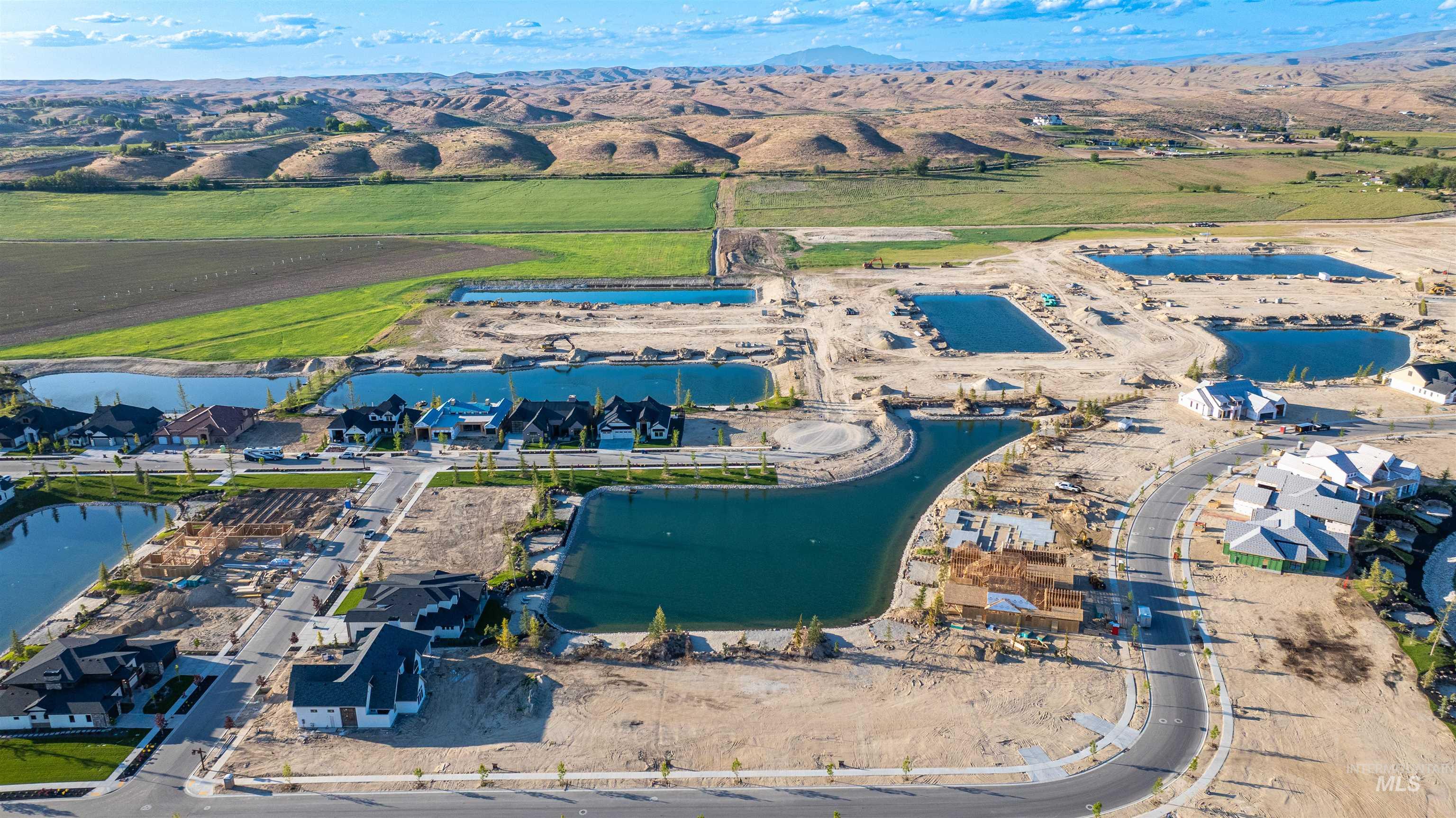 Aerial overview of property's location with a large body of water