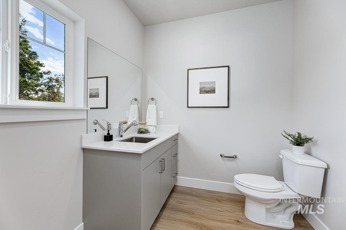 Bathroom with vanity and light wood-style floors
