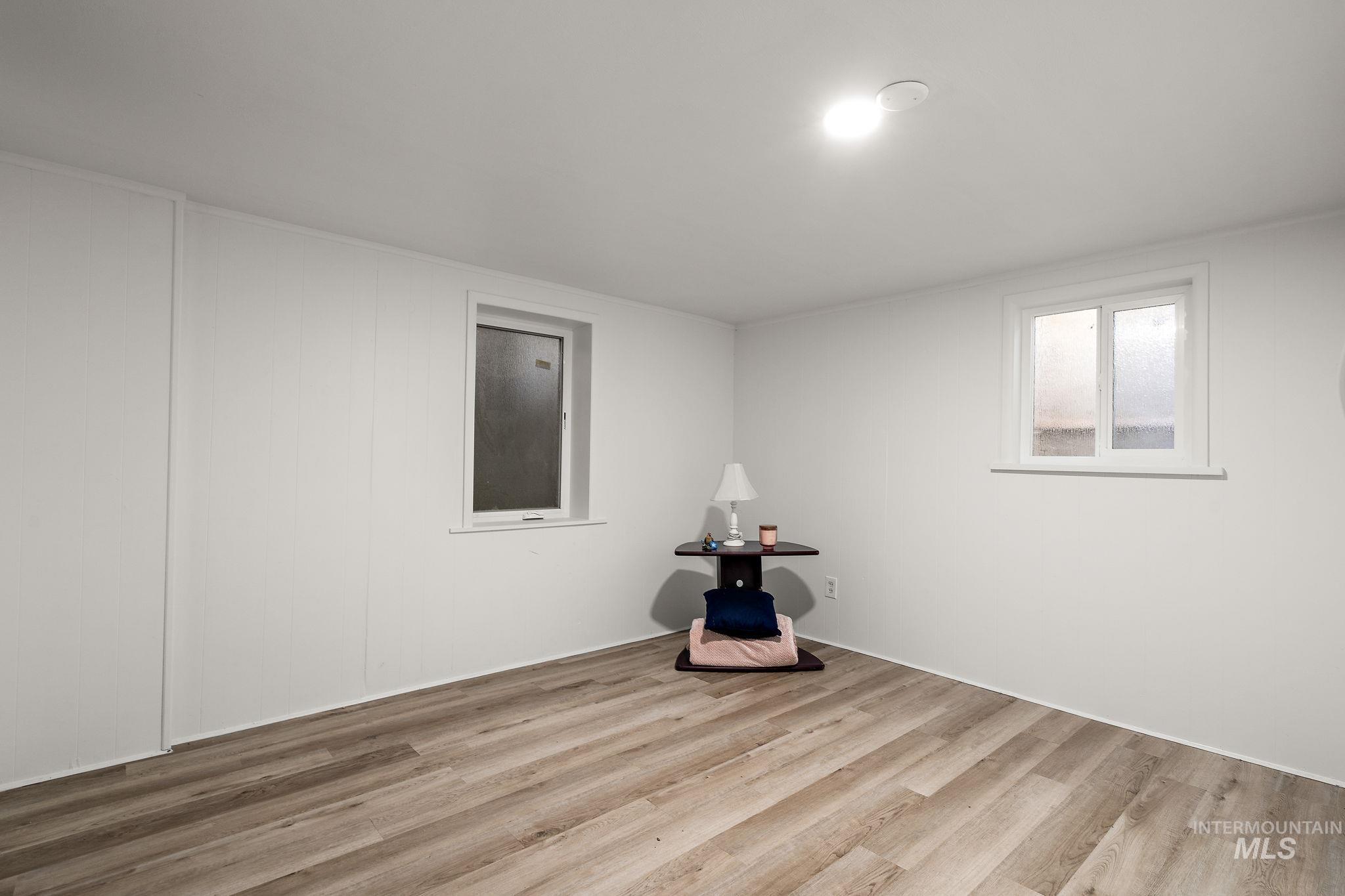 Spare room with wood finished floors