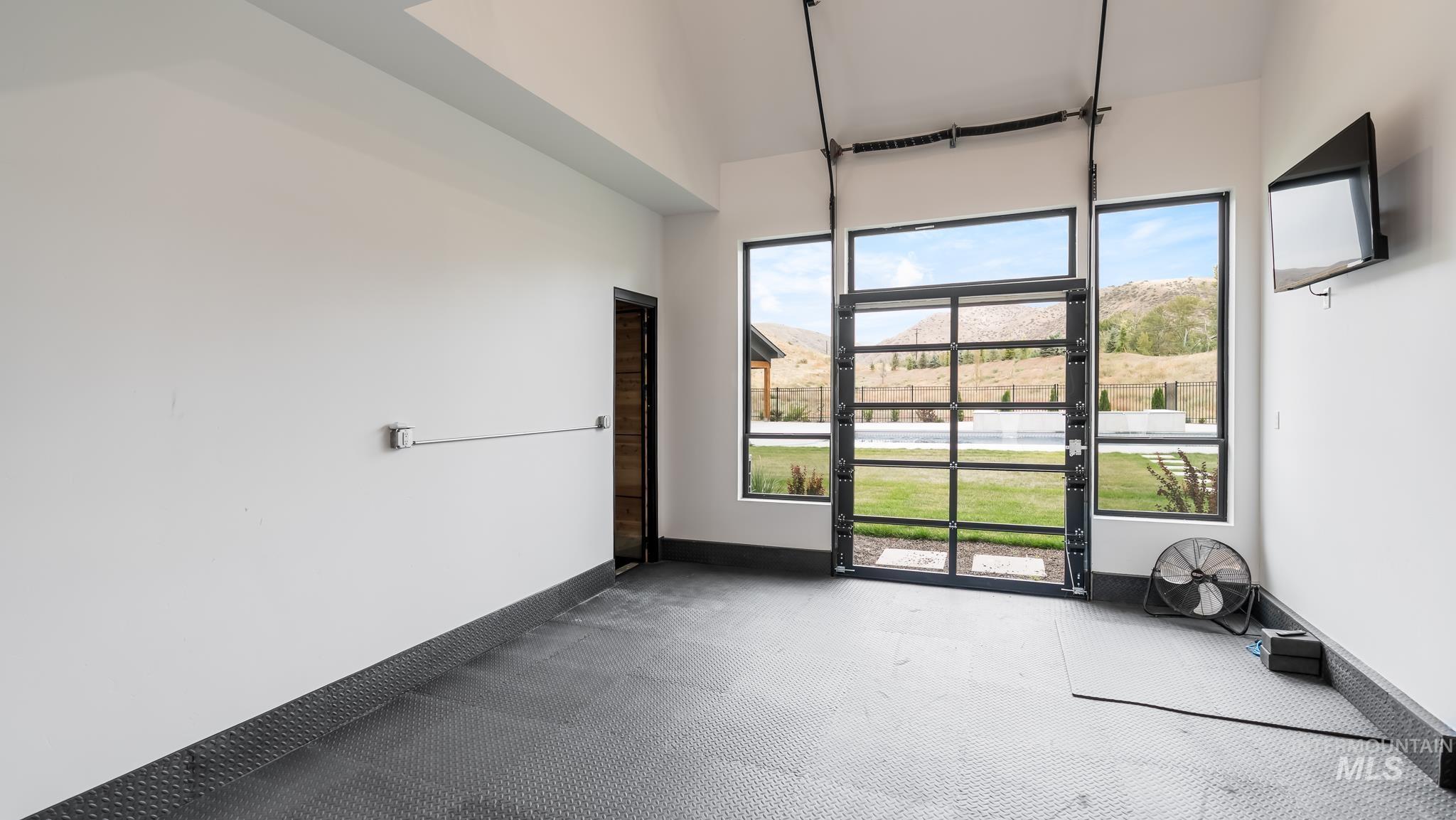 Spare room featuring baseboards