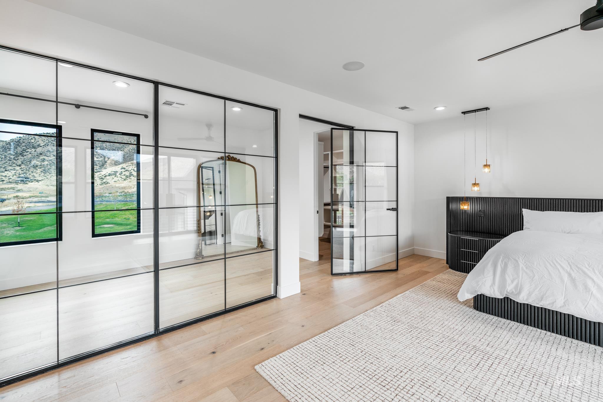 Bedroom with light wood-style flooring and recessed lighting