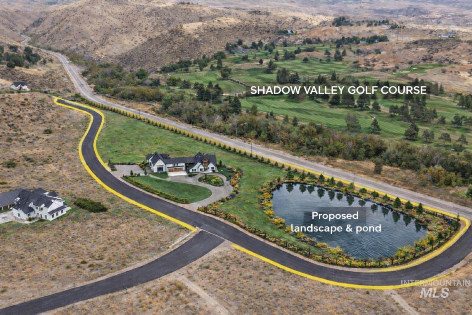 Aerial view of property's location with a water and mountain view