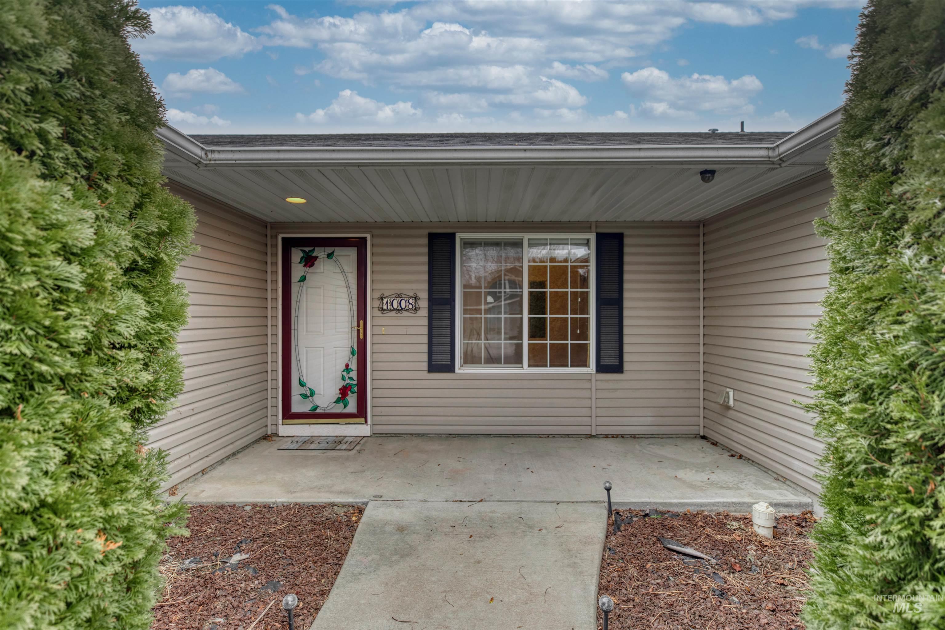 Property entrance featuring covered porch