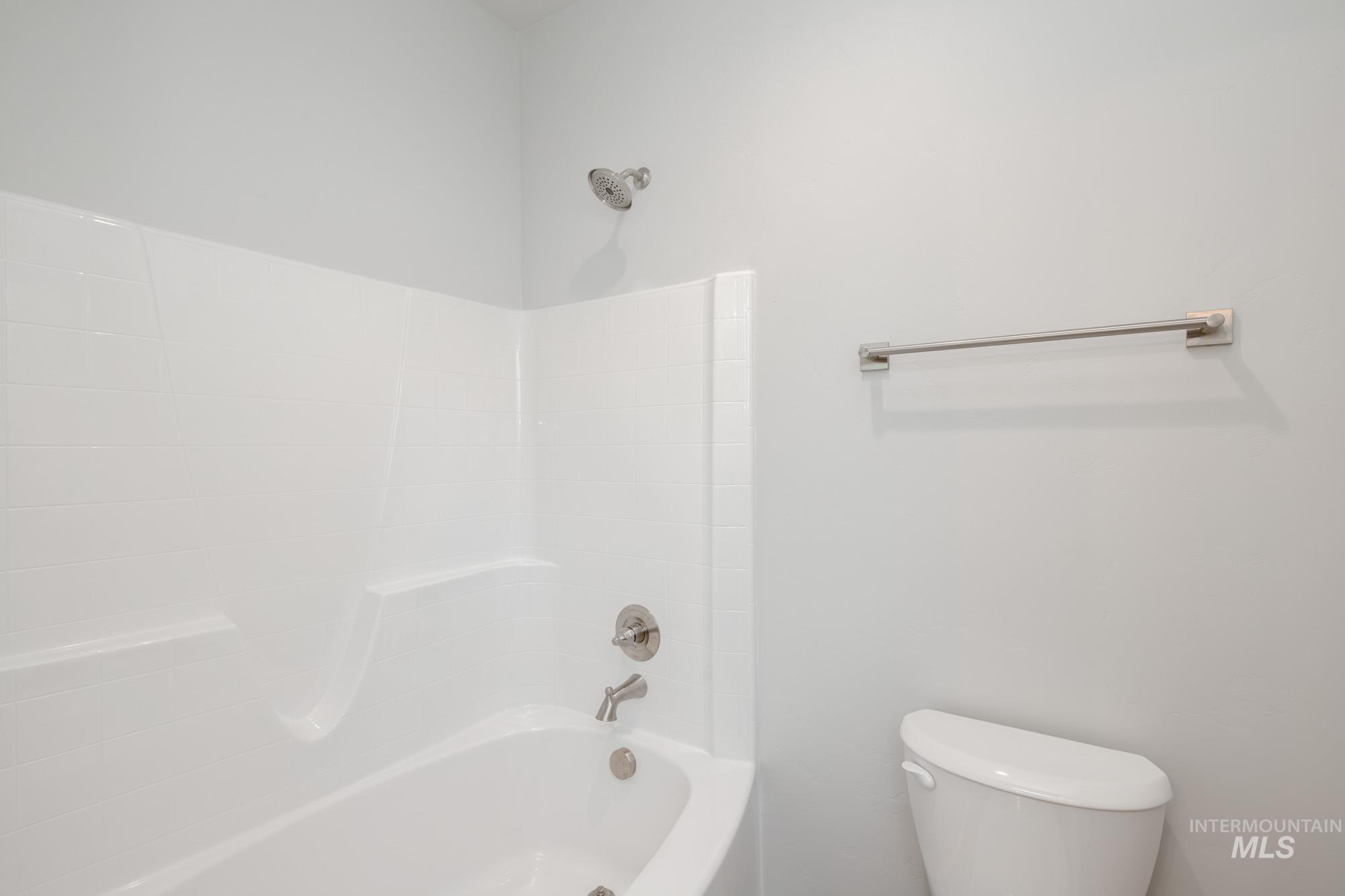 Full bathroom with  shower combination and toilet