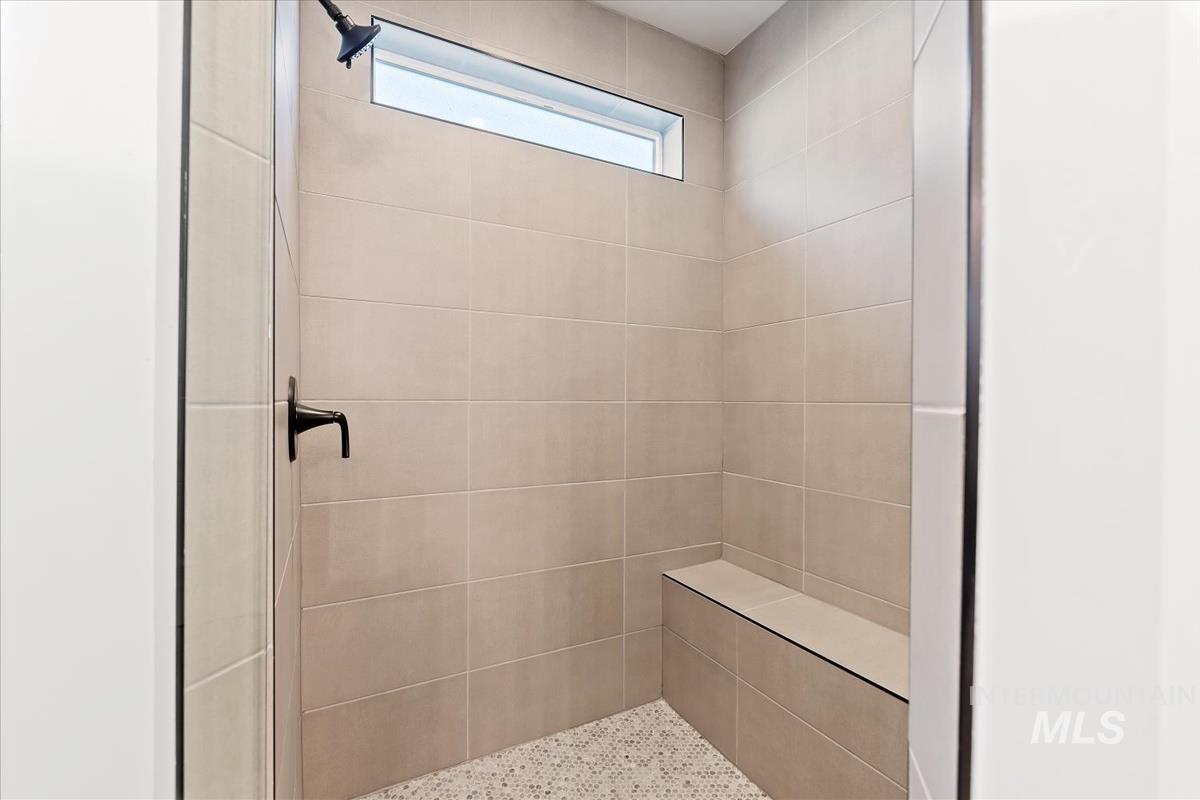 Full bath with a shower stall