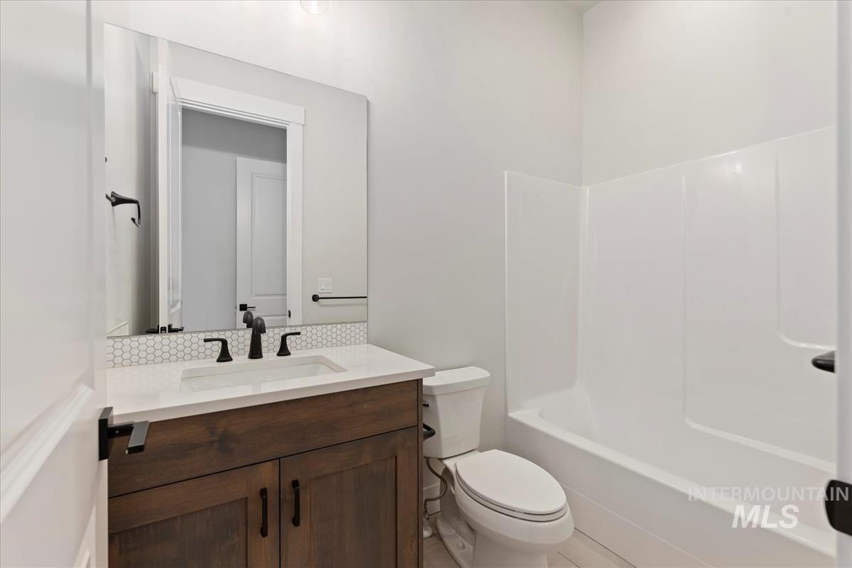 Full bathroom with vanity and shower / tub combination
