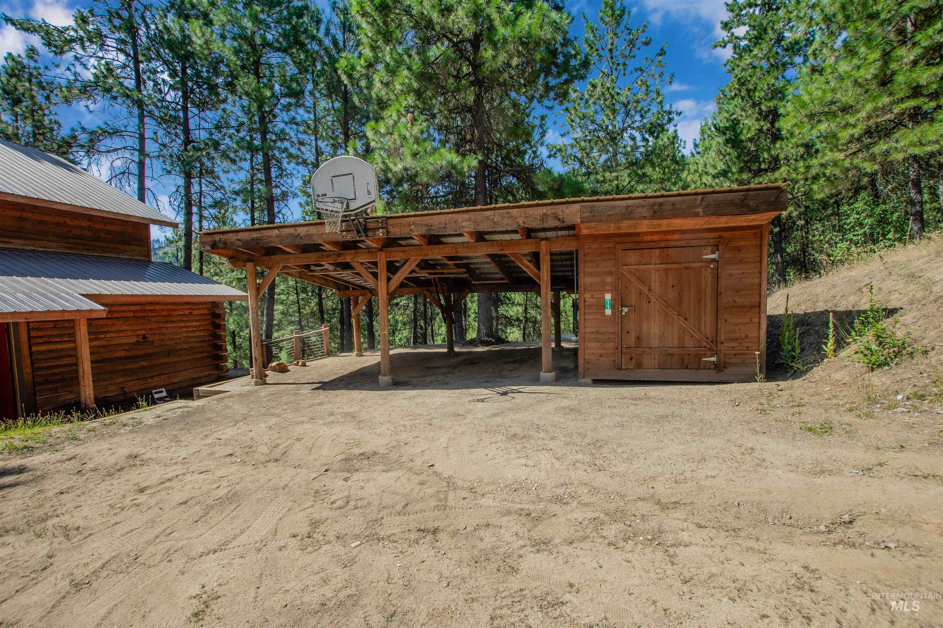 View of parking / parking lot with a carport