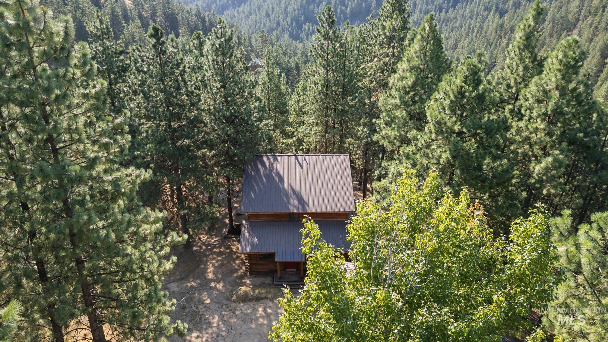 View from above of property featuring a forest