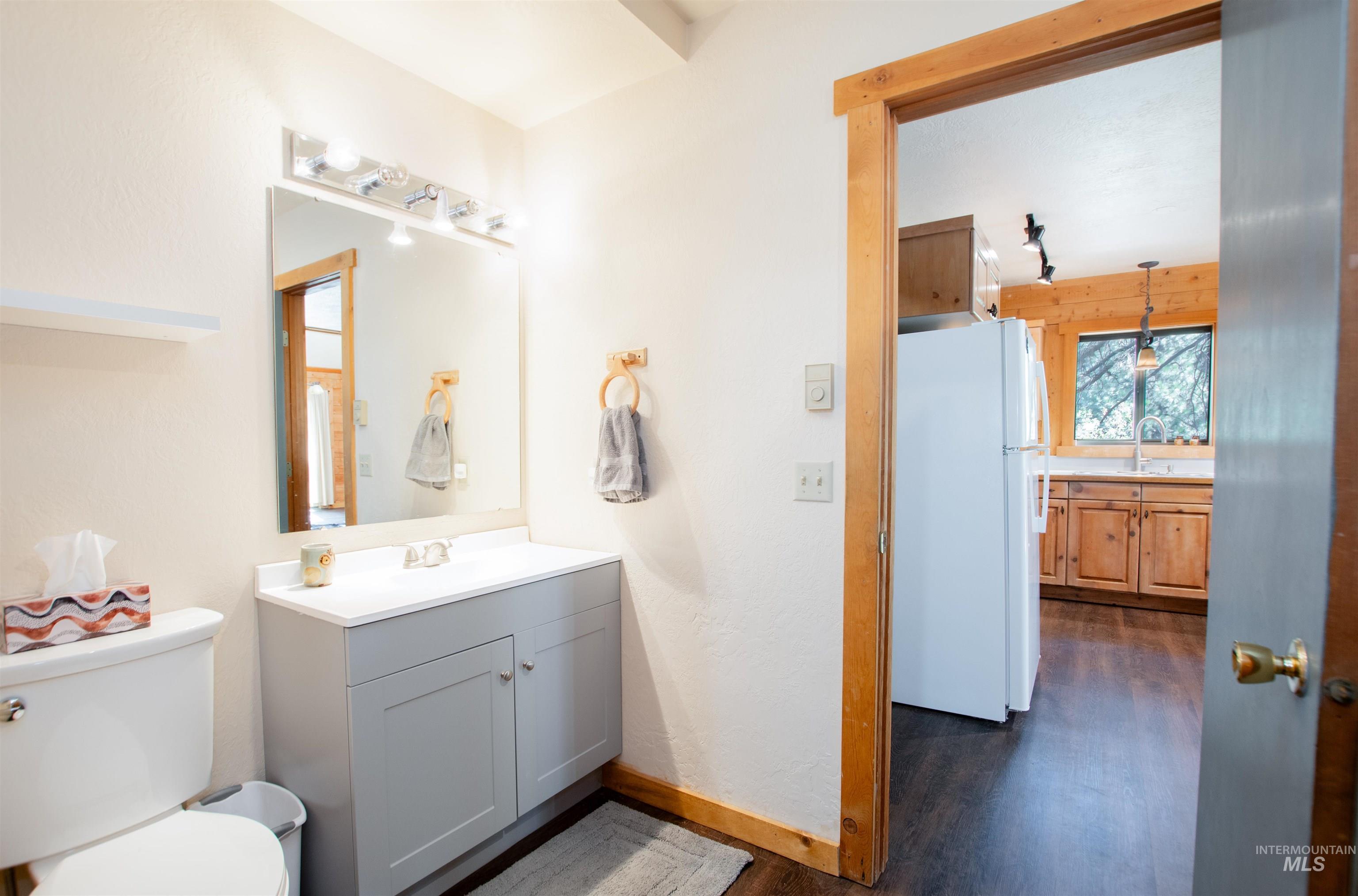 Bathroom featuring vanity and wood finished floors