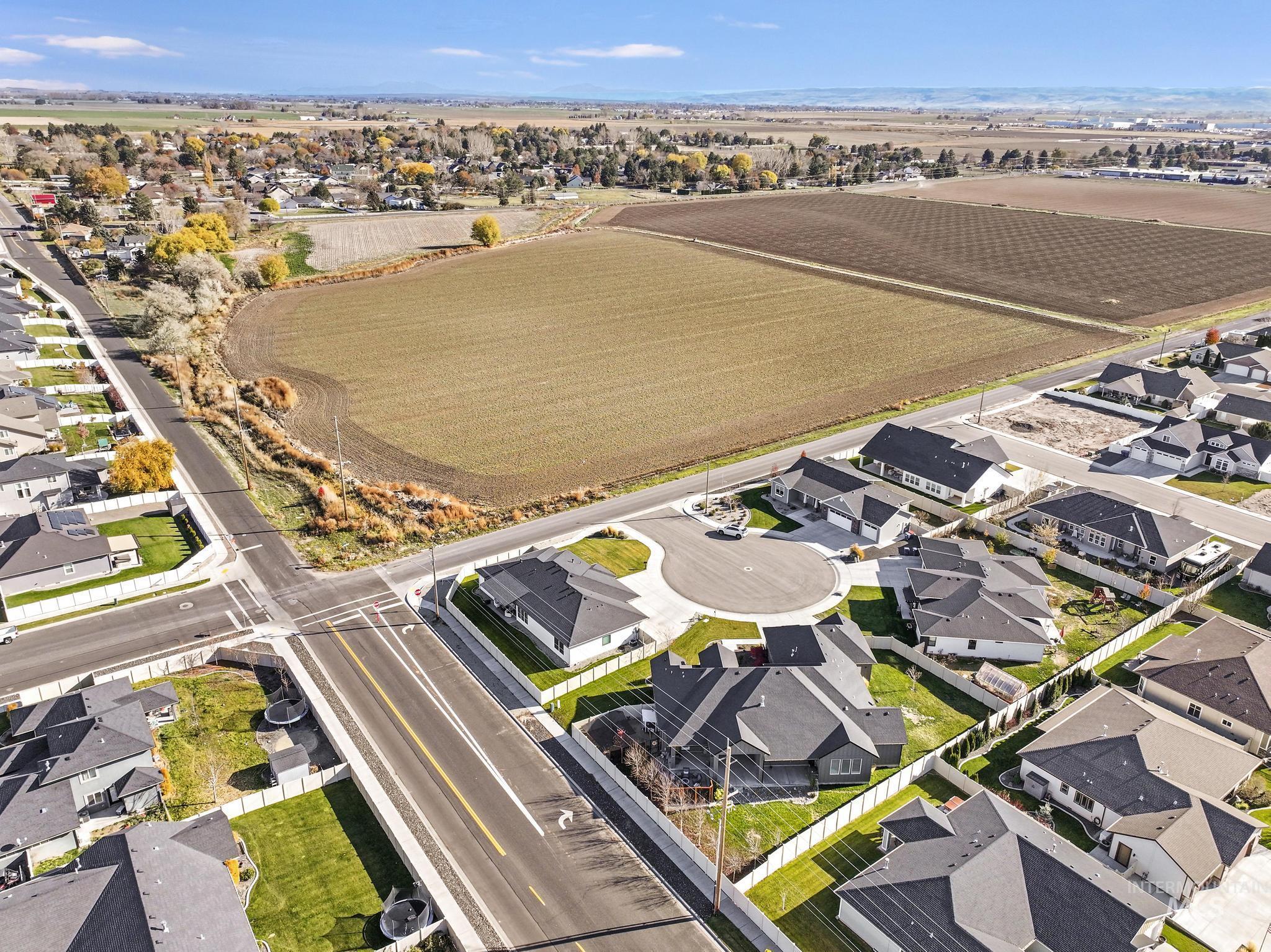Overview of rural landscape featuring nearby suburban area