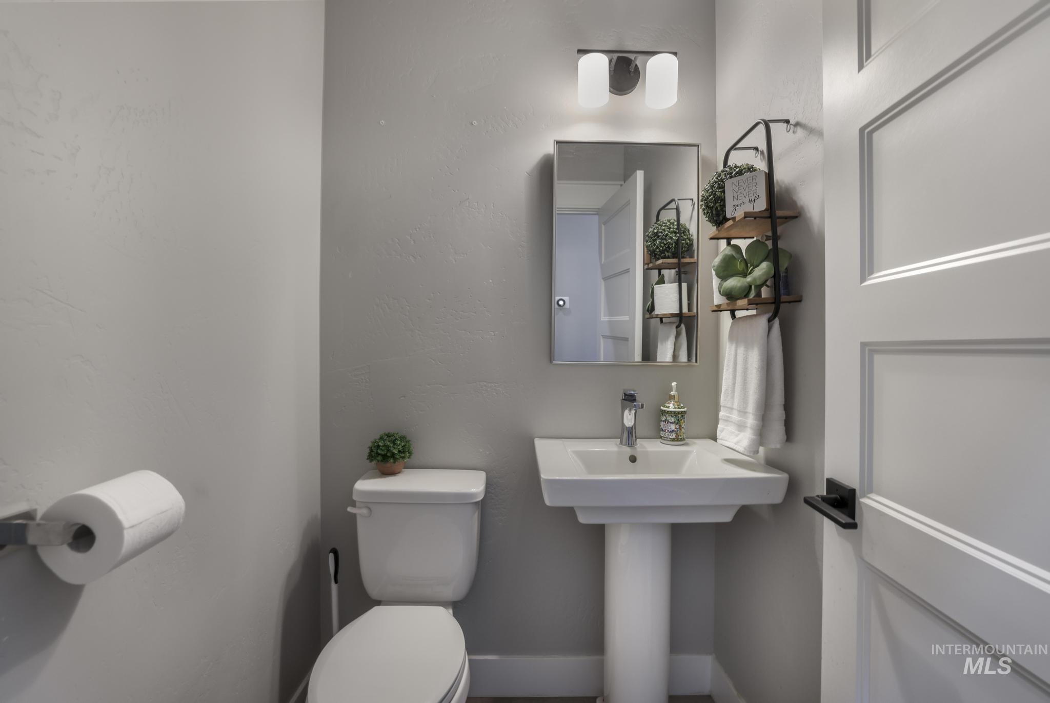 Bathroom featuring a textured wall