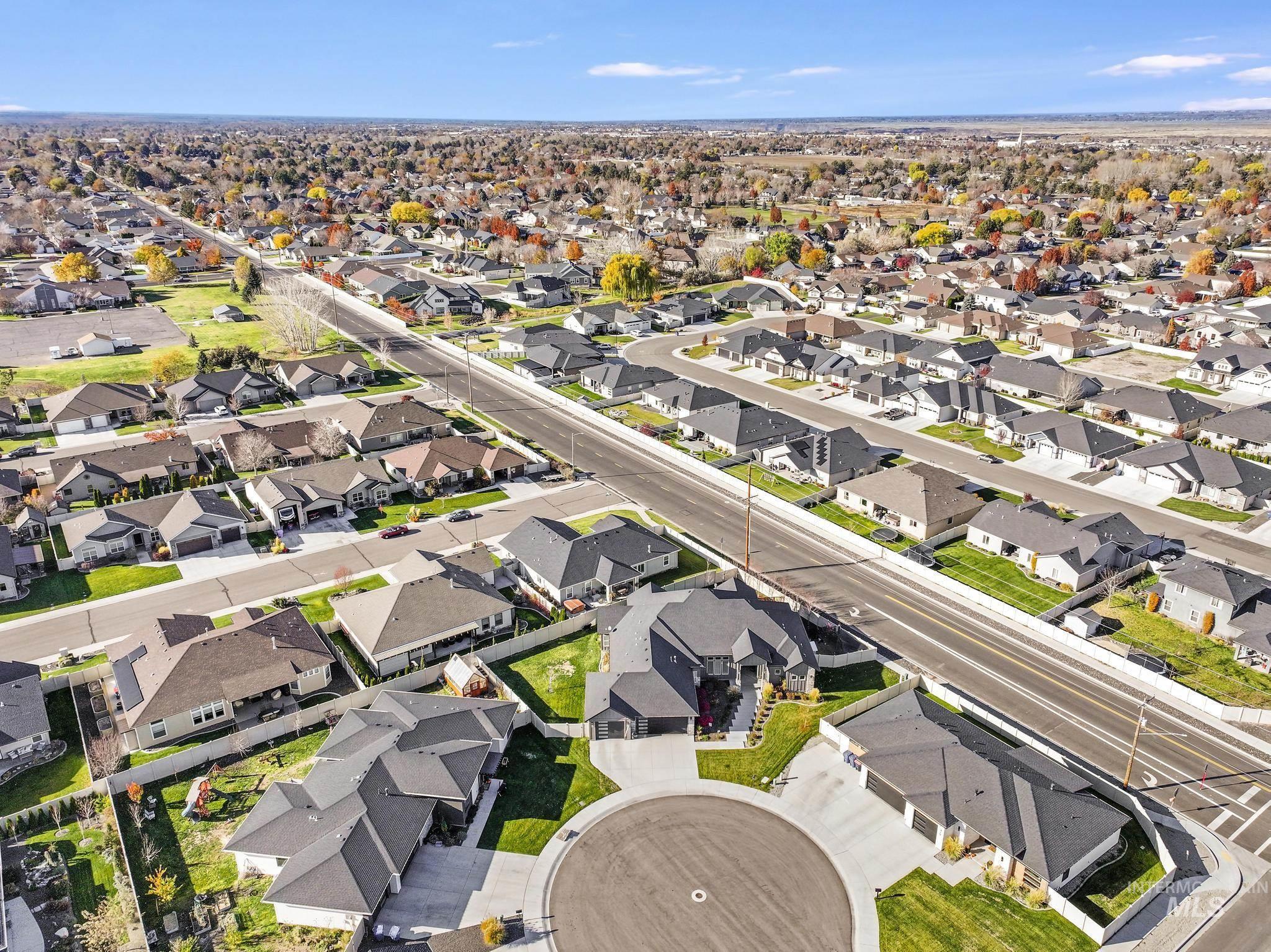 Aerial overview of property's location featuring nearby suburban area