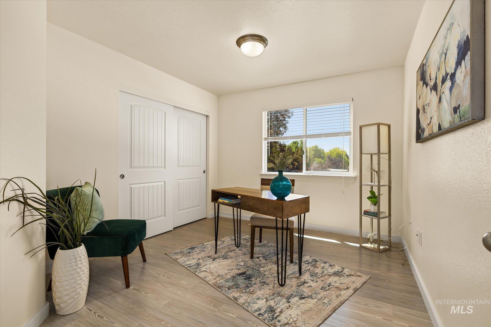 Office featuring baseboards and wood finished floors