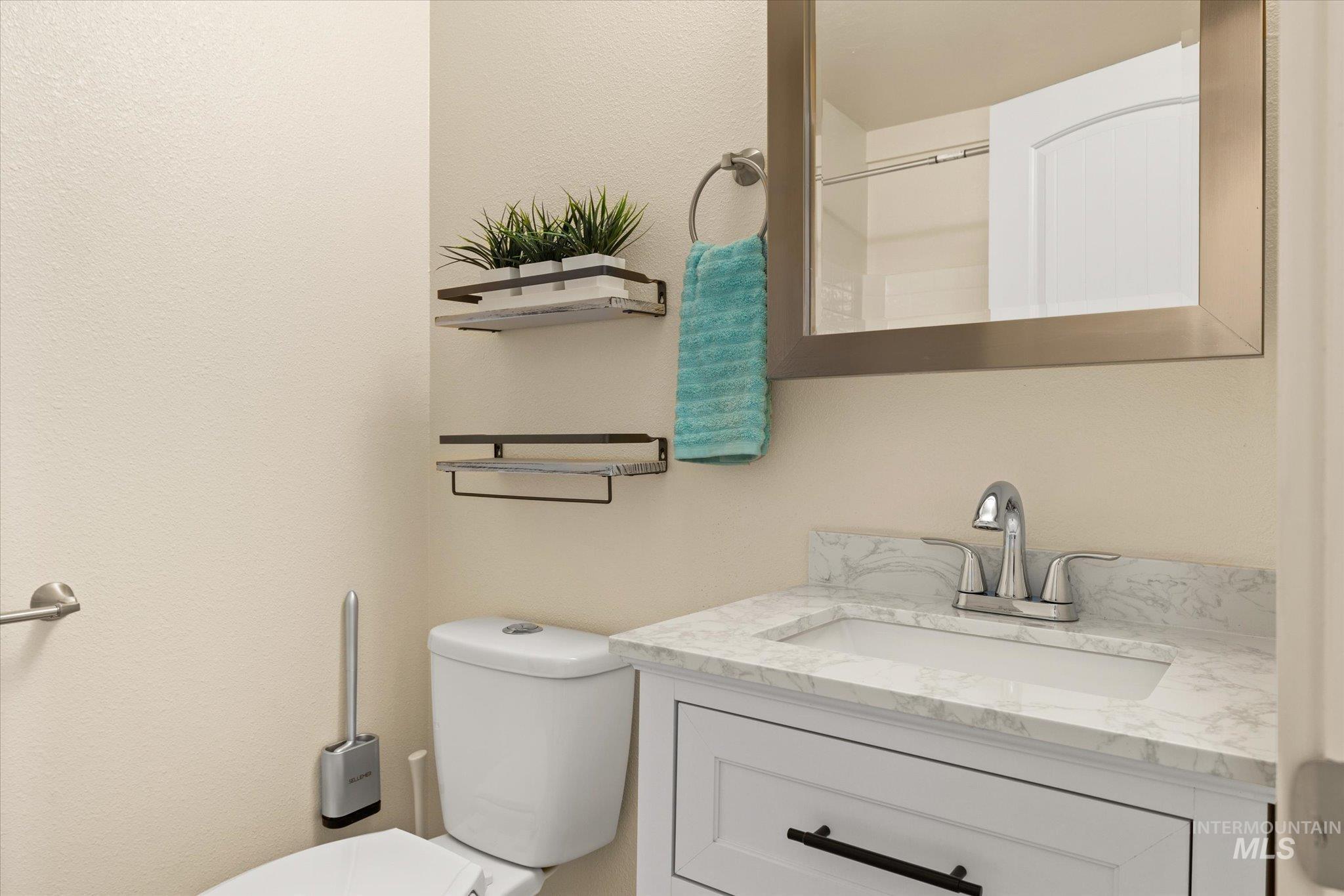 Bathroom with vanity and toilet