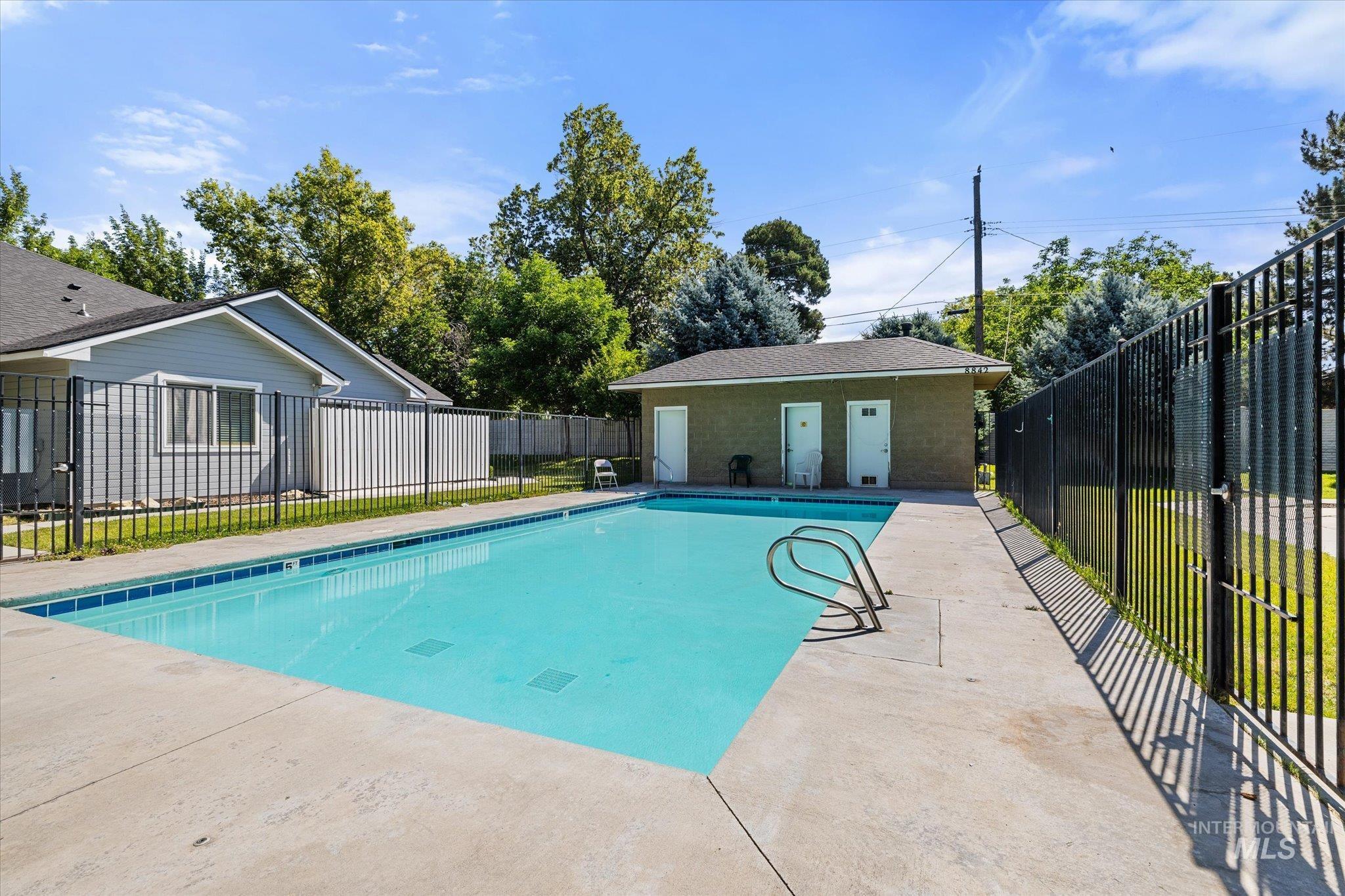 View of swimming pool with a patio area
