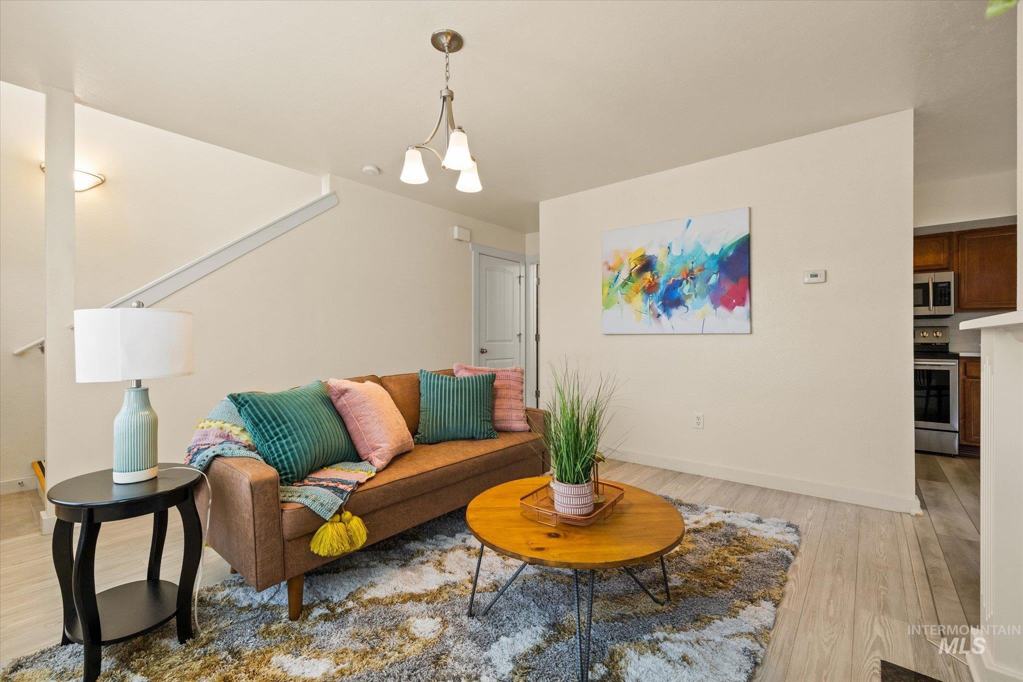 Living area featuring light wood-style floors and baseboards