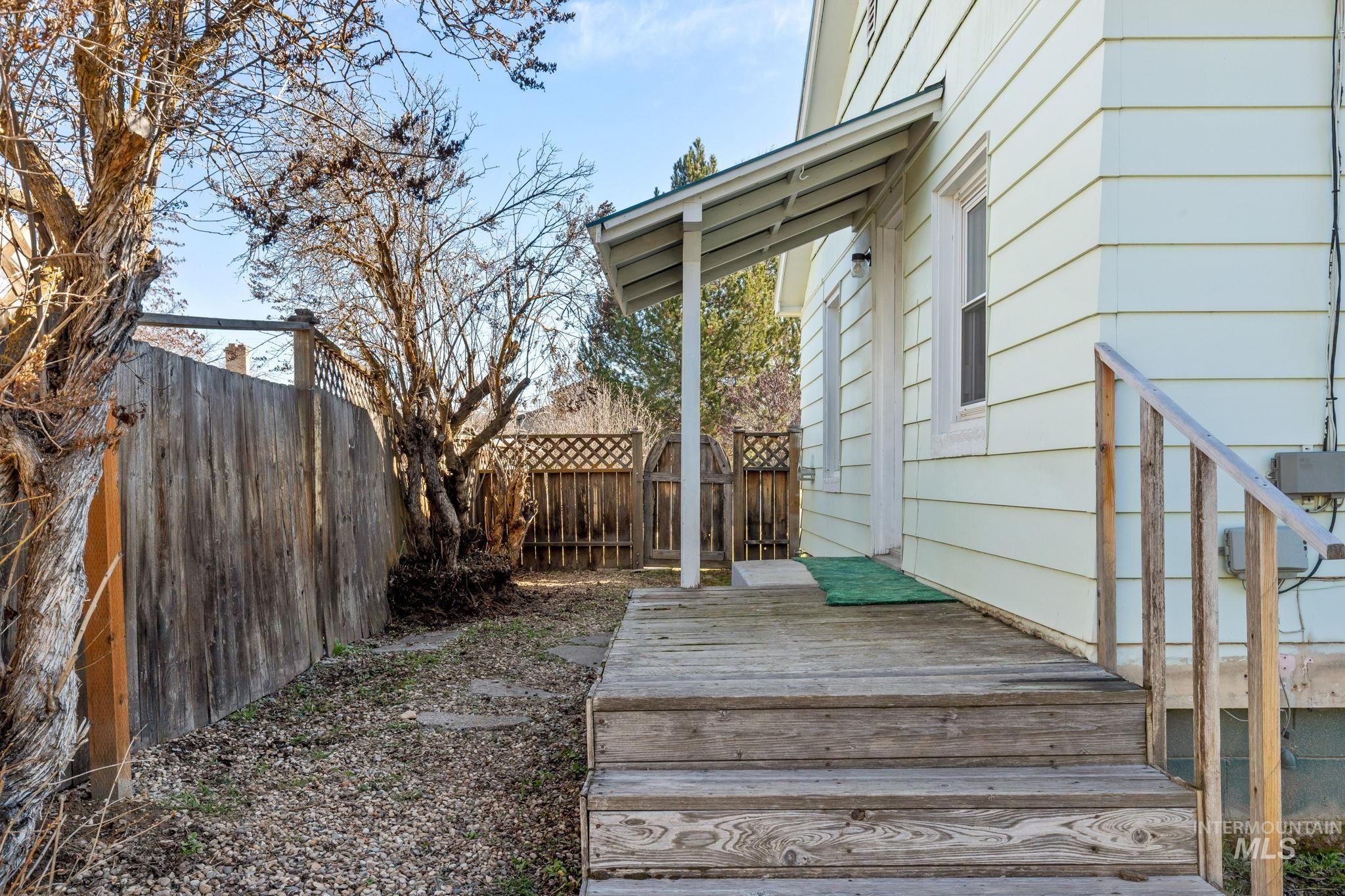 Wooden deck featuring a fenced backyard