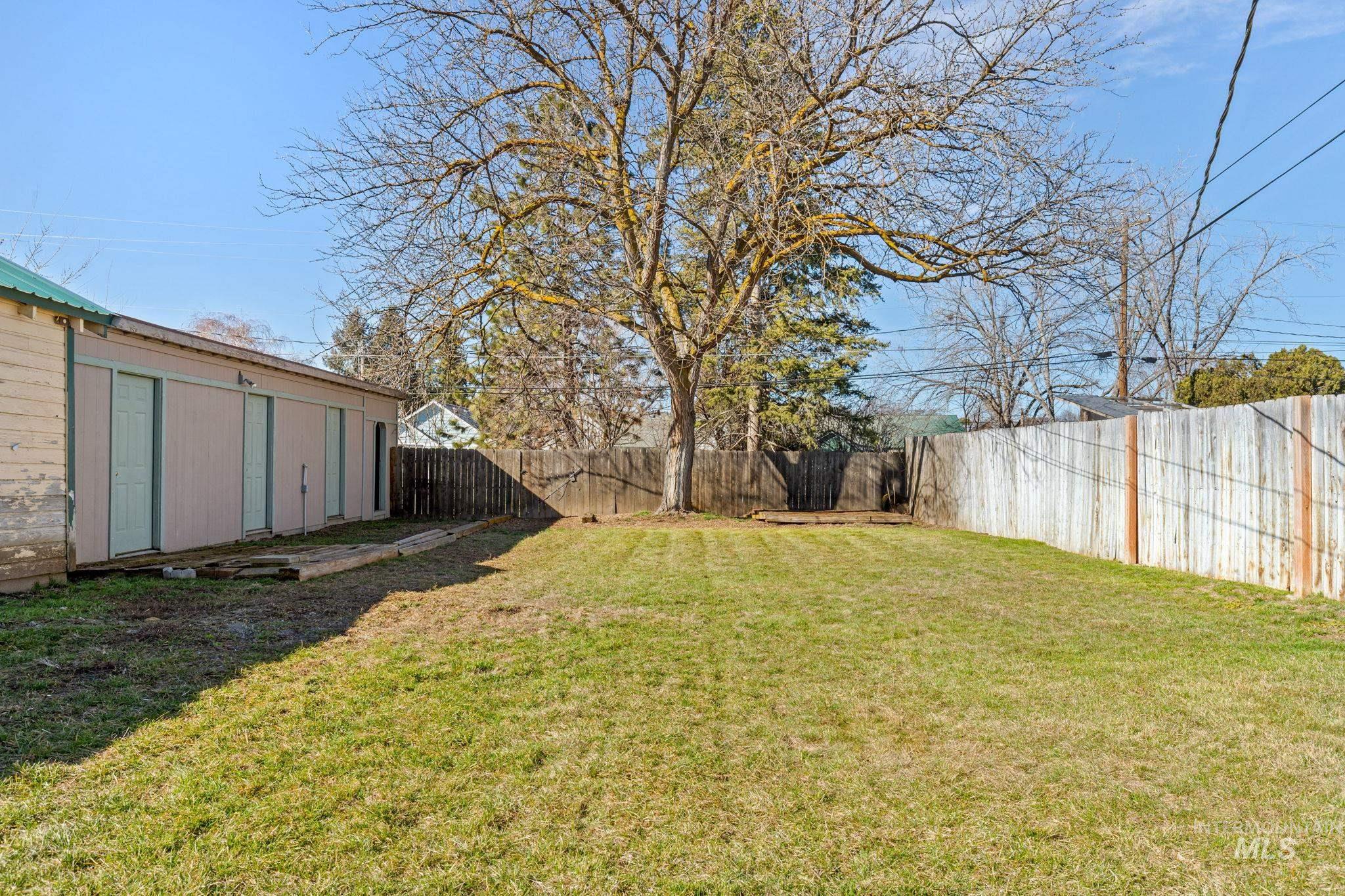 View of fenced backyard