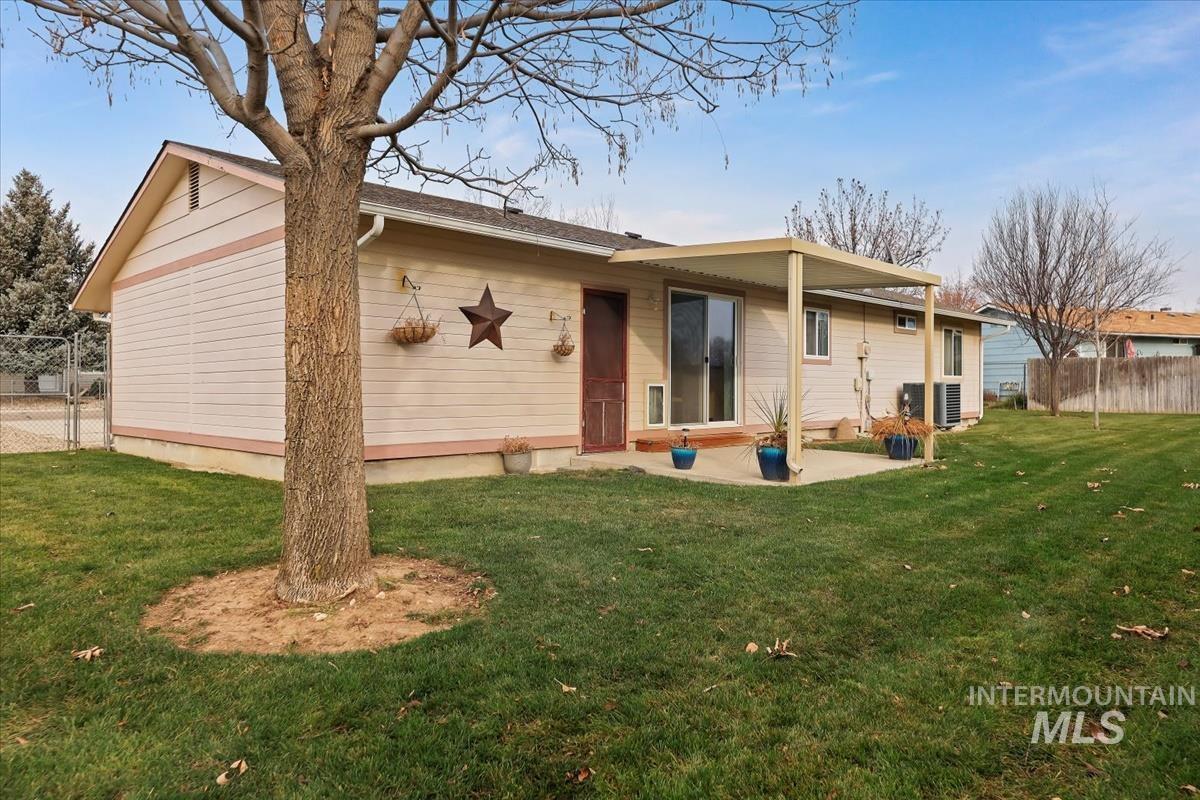 Back of house with a patio