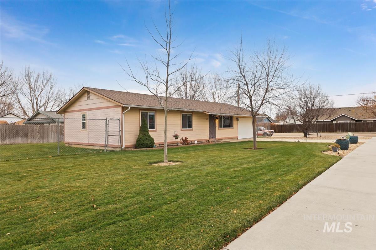 Single story home with a garage