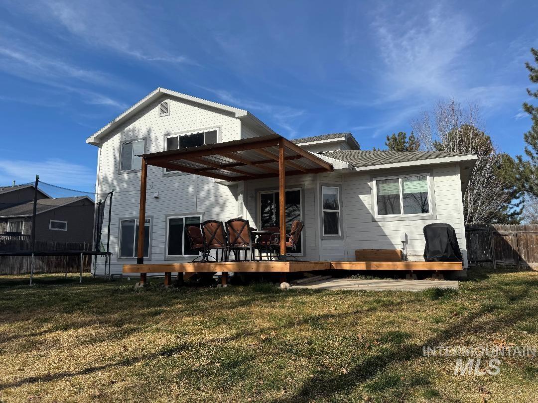 Rear view of house with a wooden deck