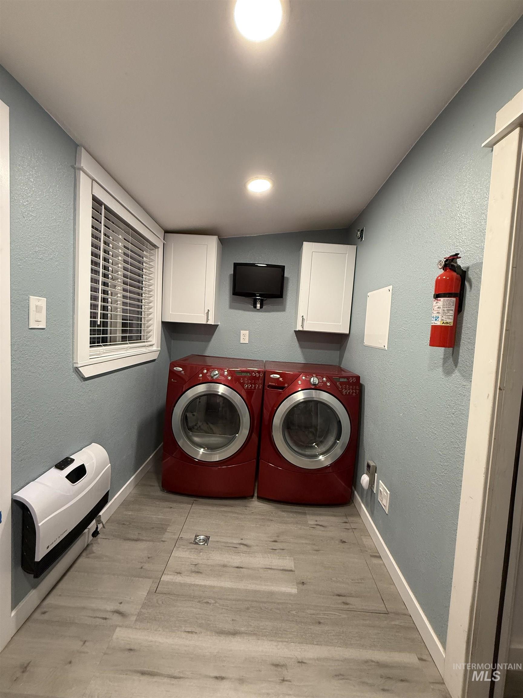 Laundry Room features: New Cabinetry, New Luxury Vinyl Plank Flooring, New Tankless Water Heater, Gas & Electrical Connections for Dryer, Freshly Painted (ALMOST COMPLETED), New Low-E Dual Pane Window, Heater, 2.5 Inch Faux Wood Blind, Networking Panel,