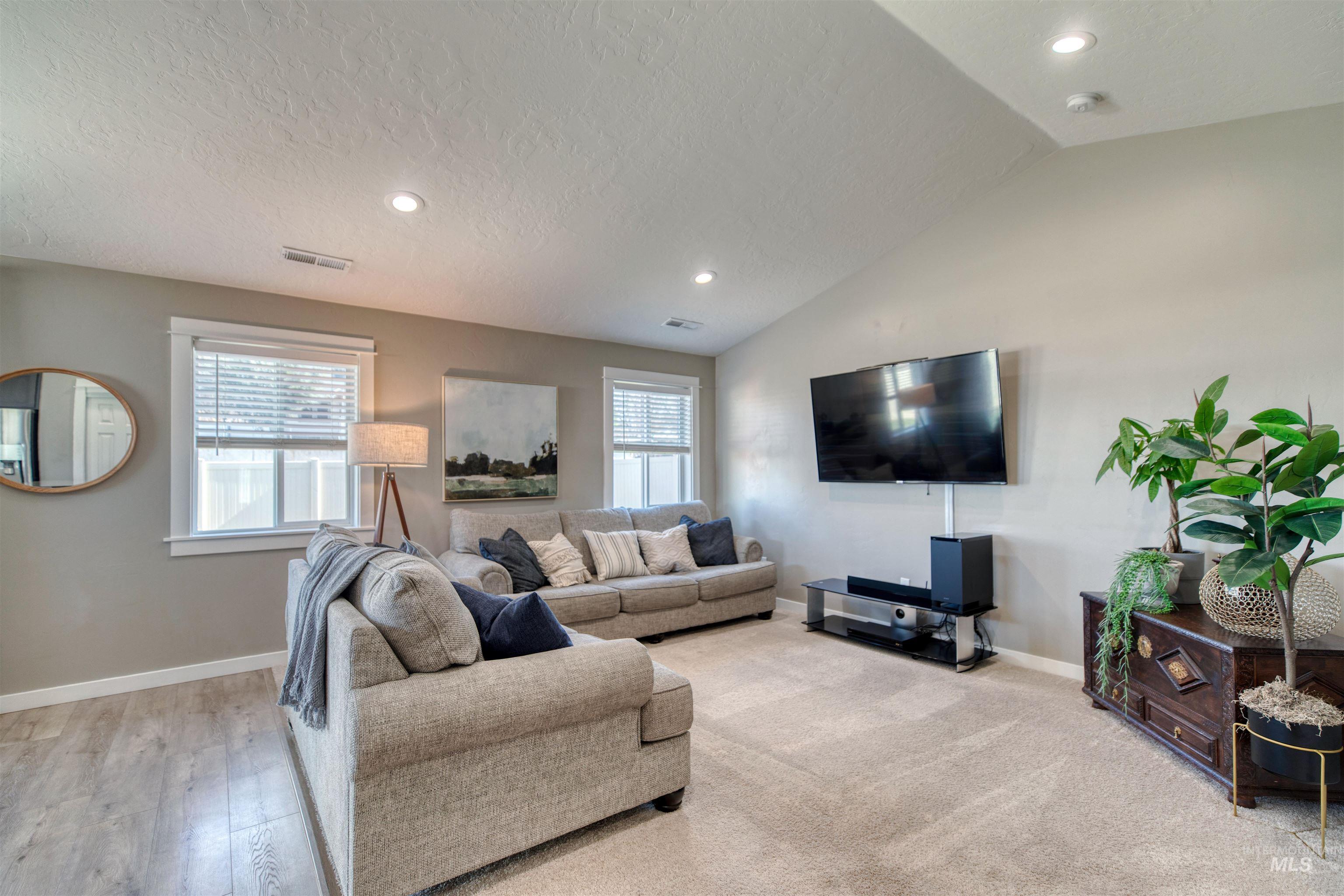 Living area featuring recessed lighting and light wood-style flooring