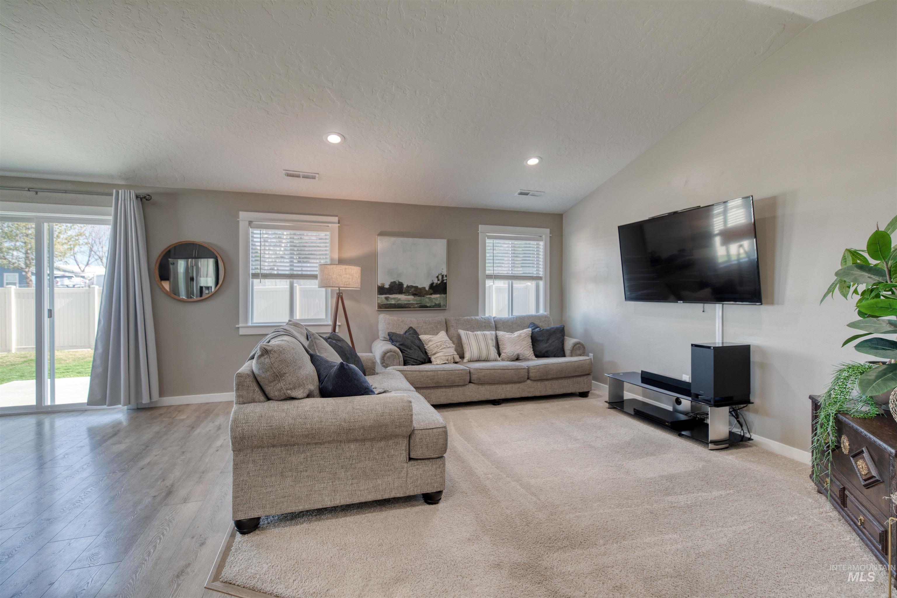Living room with baseboards and recessed lighting
