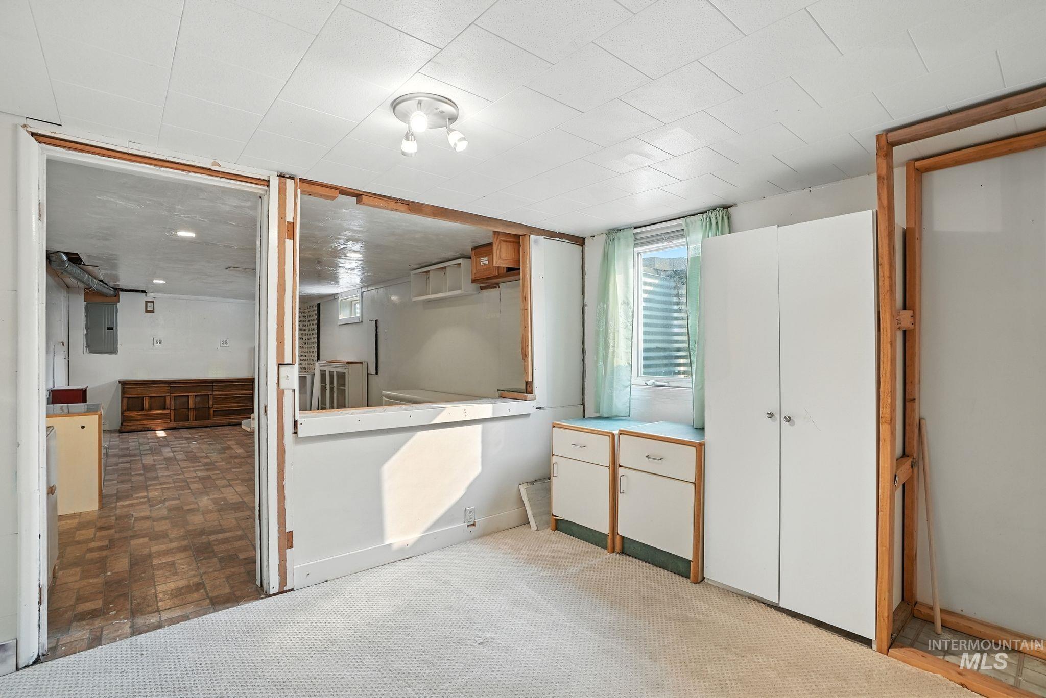 Unfurnished bedroom featuring electric panel