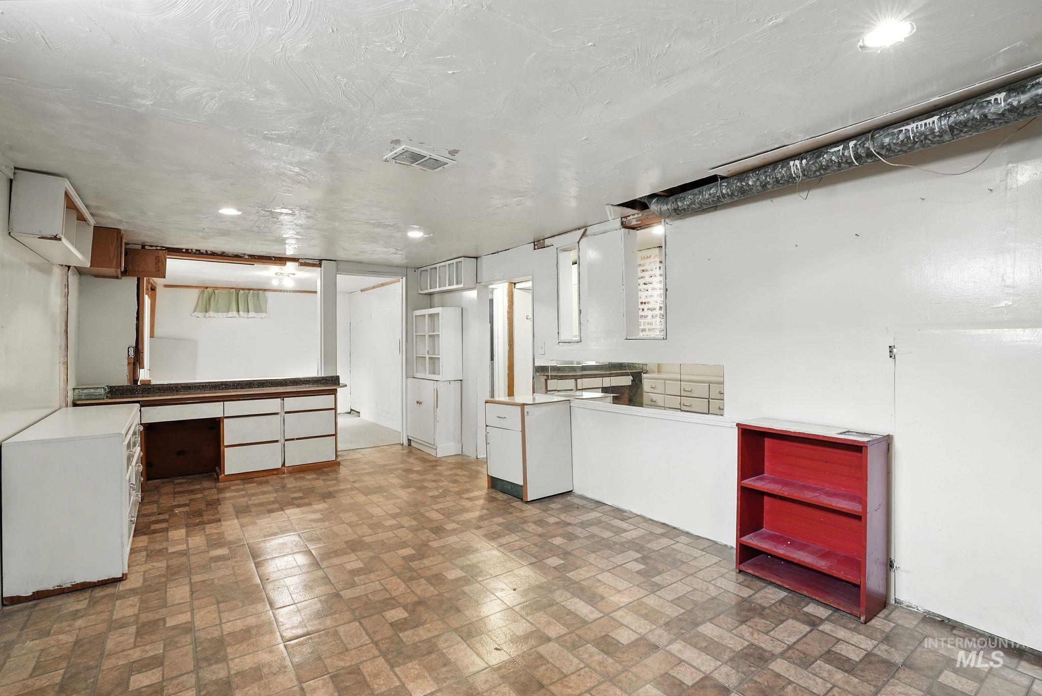Finished basement with brick patterned floors