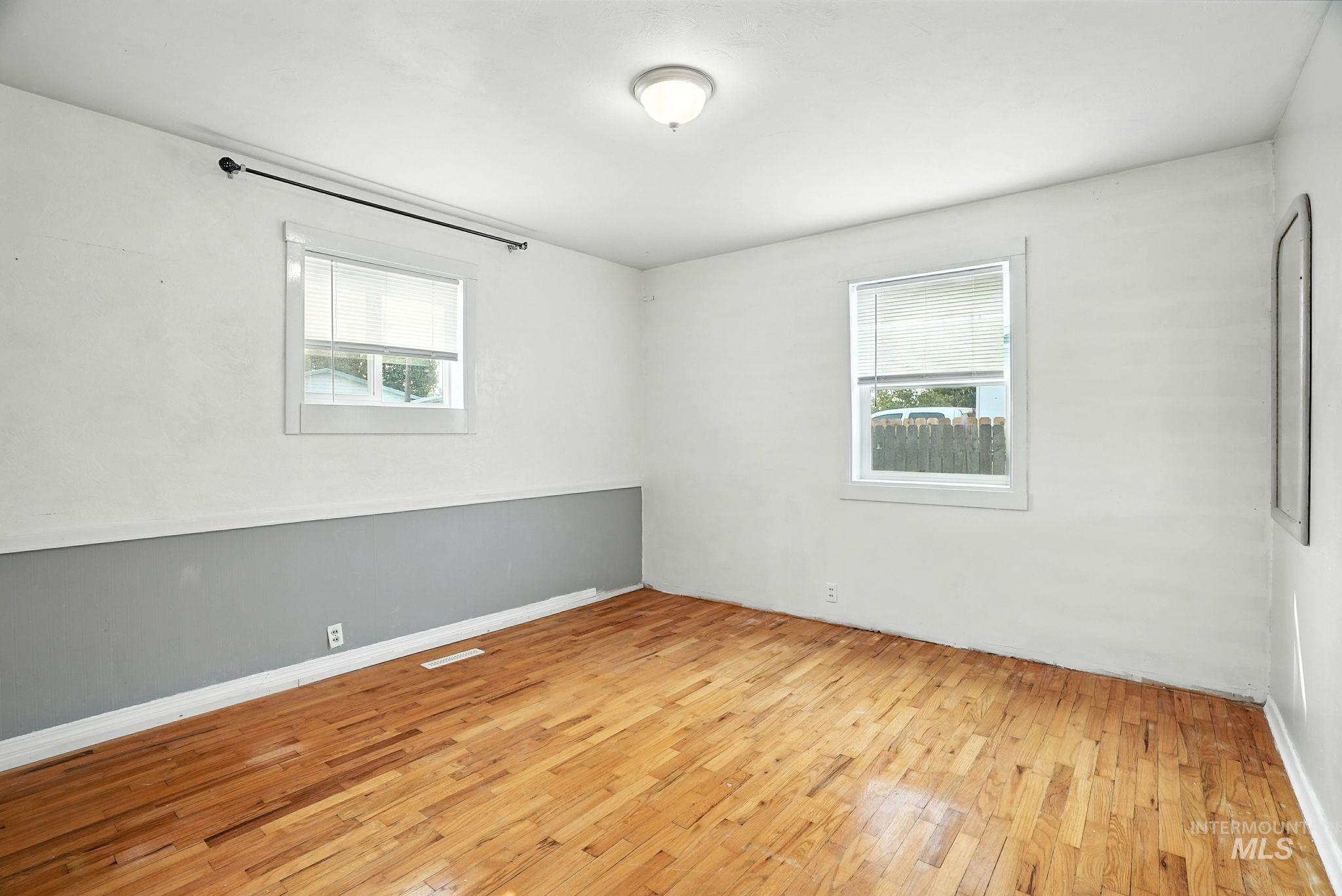 Empty room featuring light wood-style floors