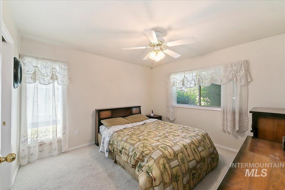 Master Bedroom featuring ceiling fan and carpet floors