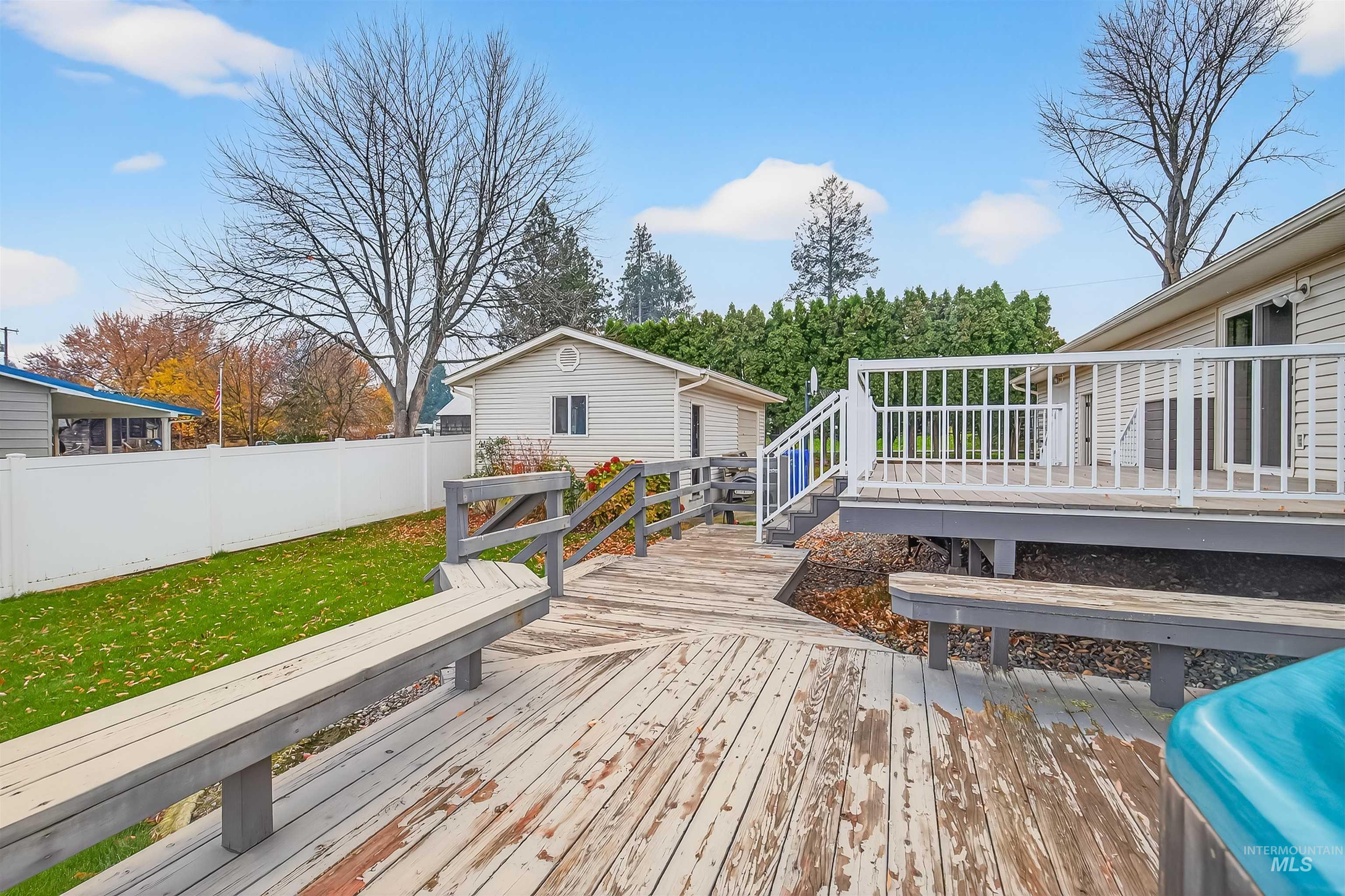 Deck with a fenced backyard