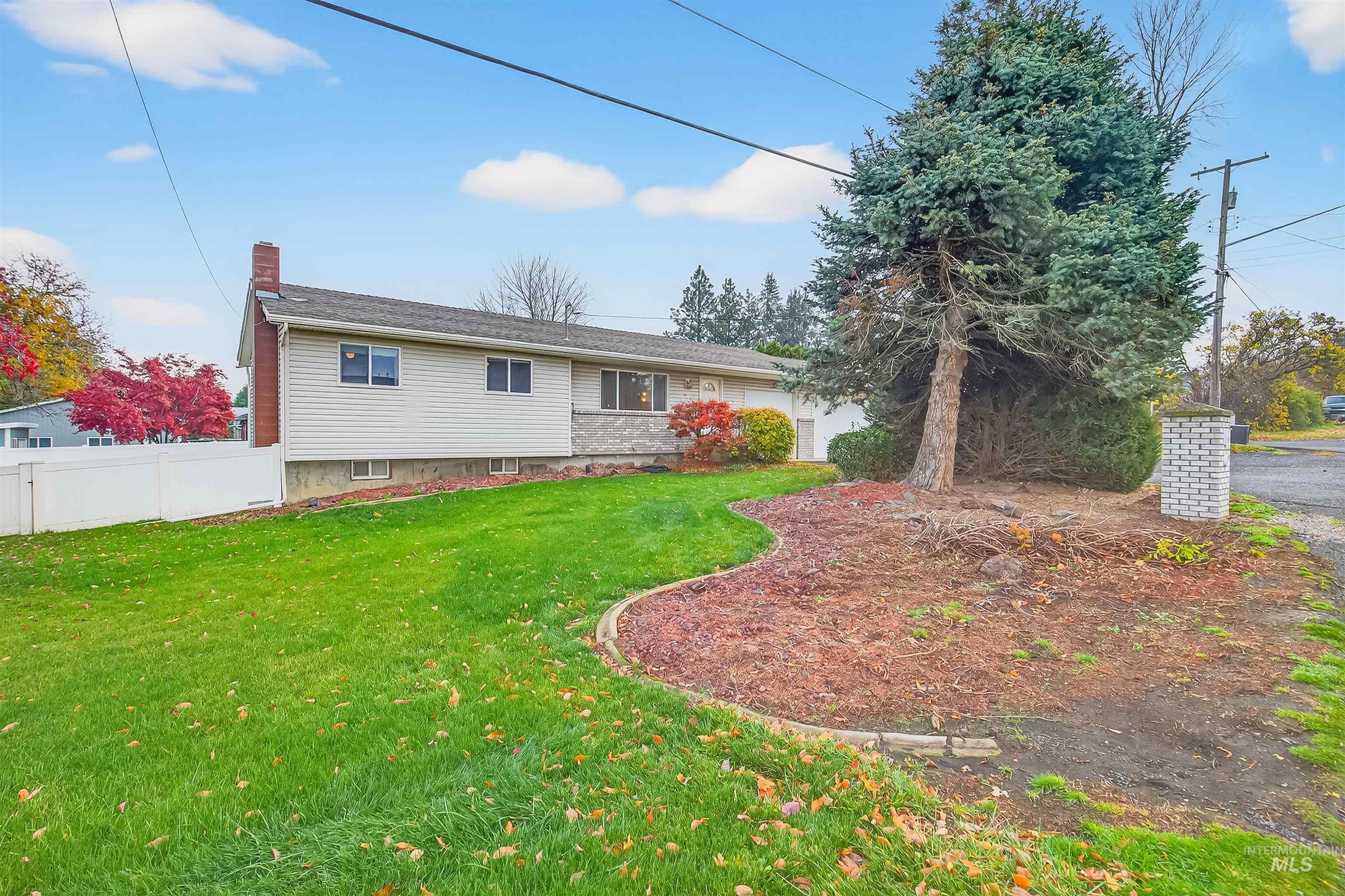 Back of house with a chimney