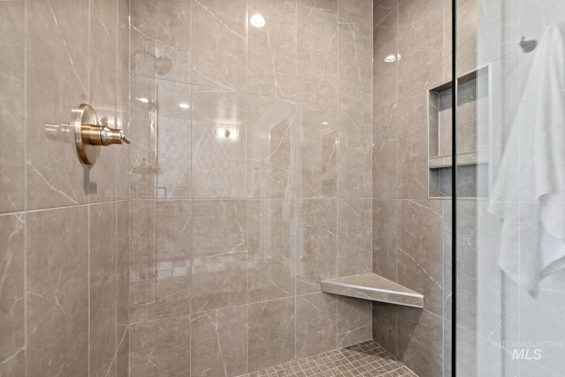 Full bathroom featuring a shower stall