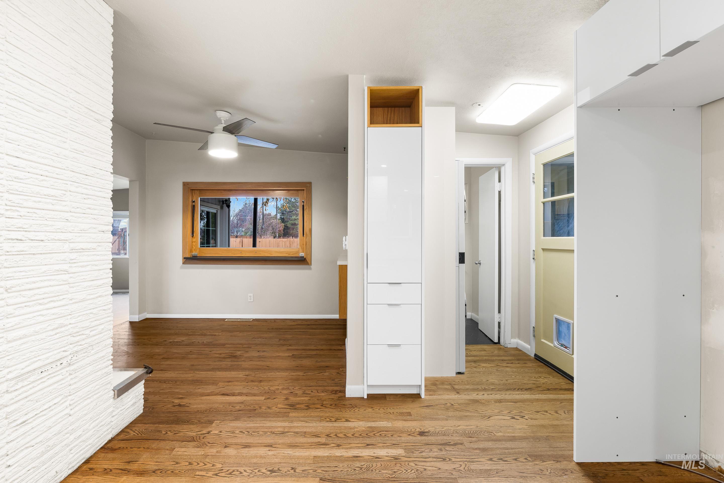 Hall featuring light wood-style flooring