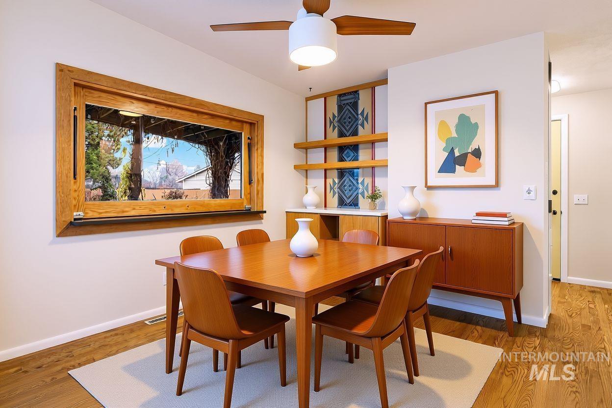 Dining space featuring light wood-type flooring and ceiling fan