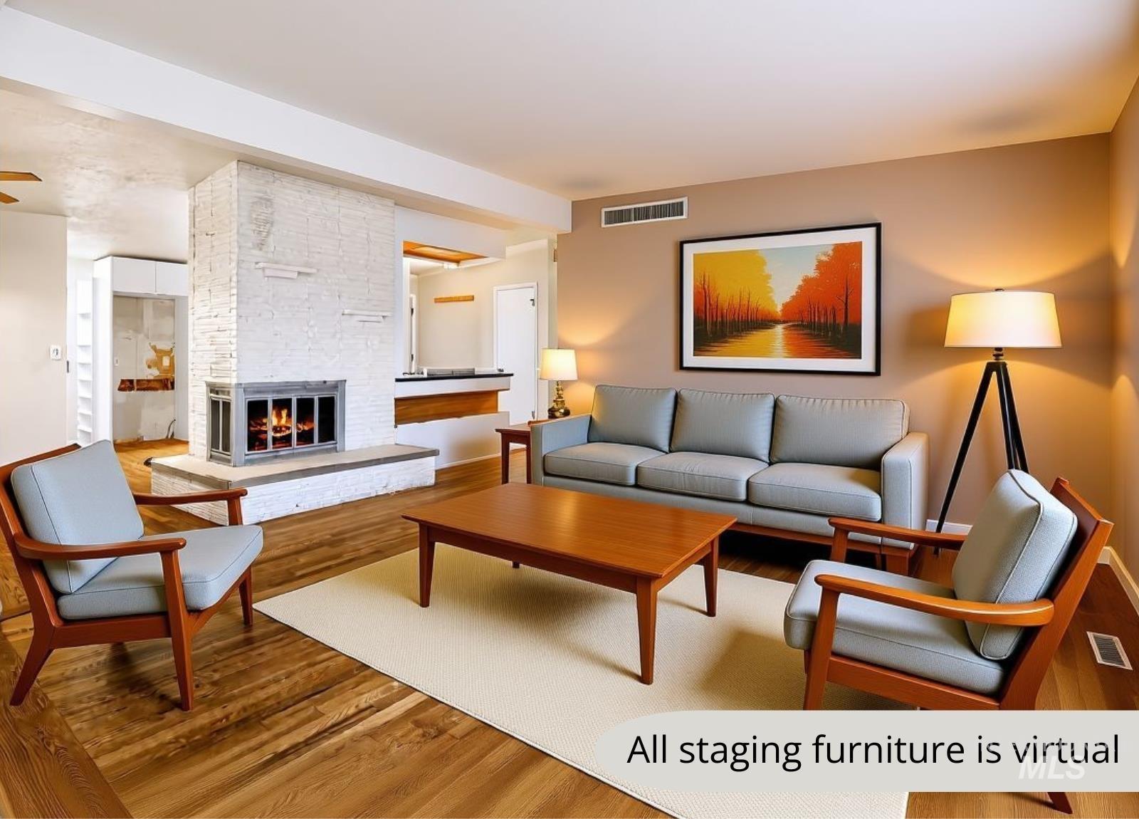 Living room featuring a brick fireplace and wood finished floors