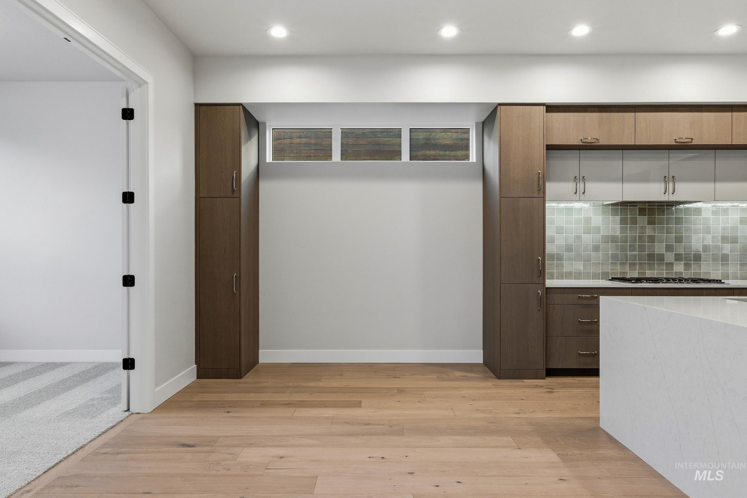 Mudroom featuring light wood-type flooring and recessed lighting