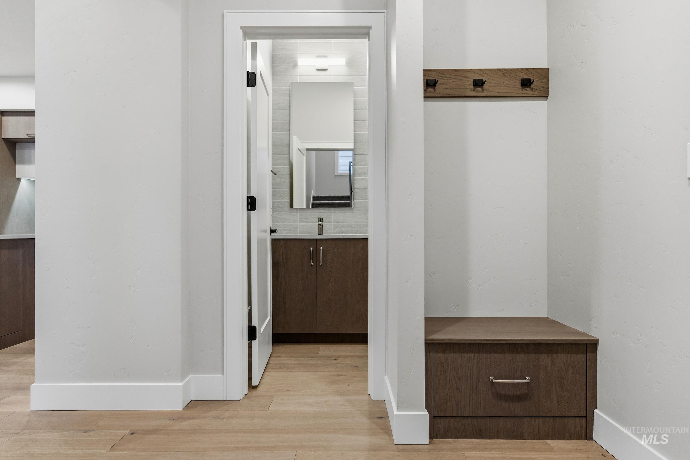 Mudroom featuring light wood-style flooring