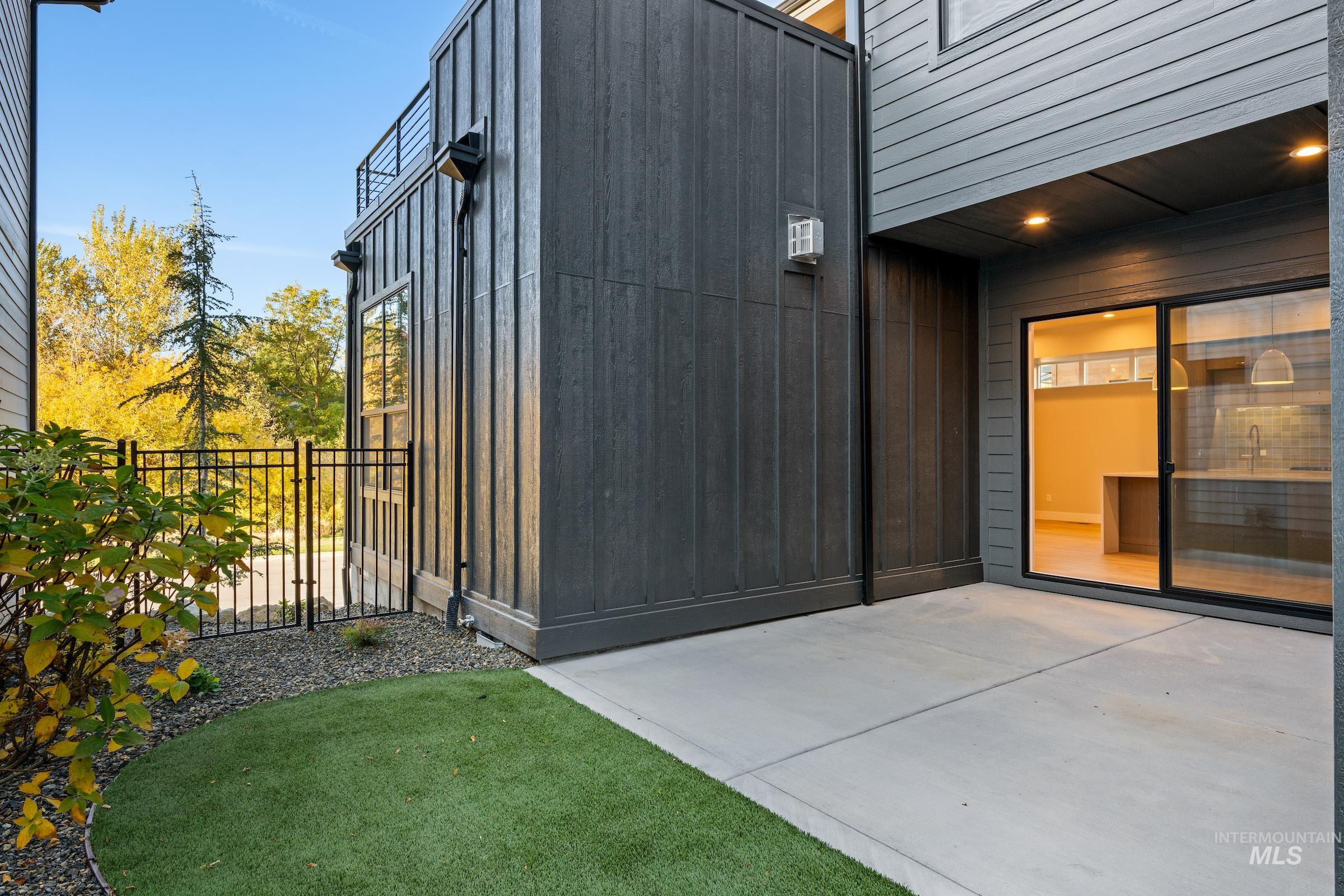 Doorway to property featuring a patio area