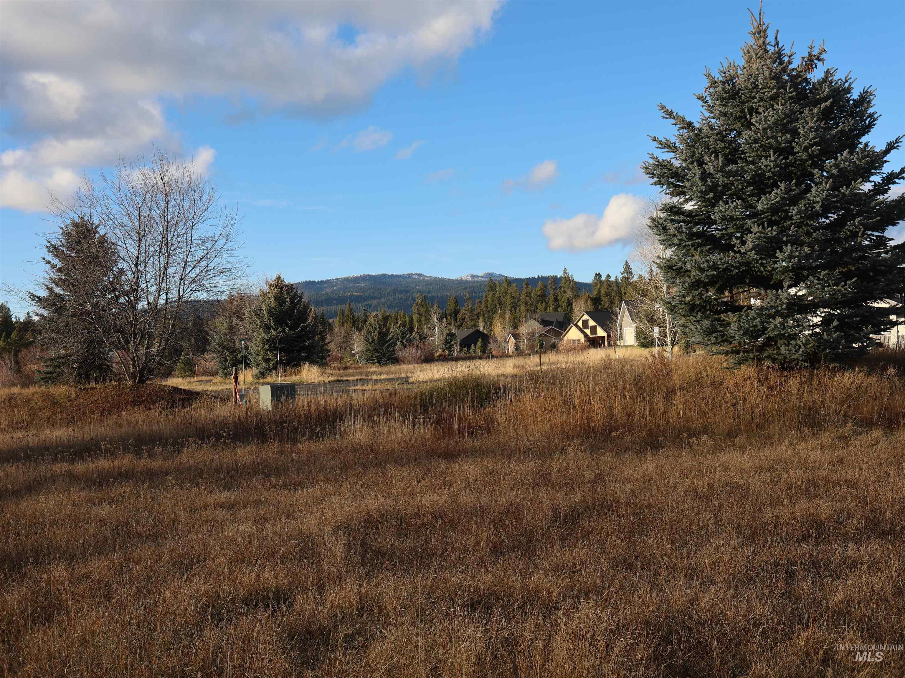 View of mountain background featuring rural landscape