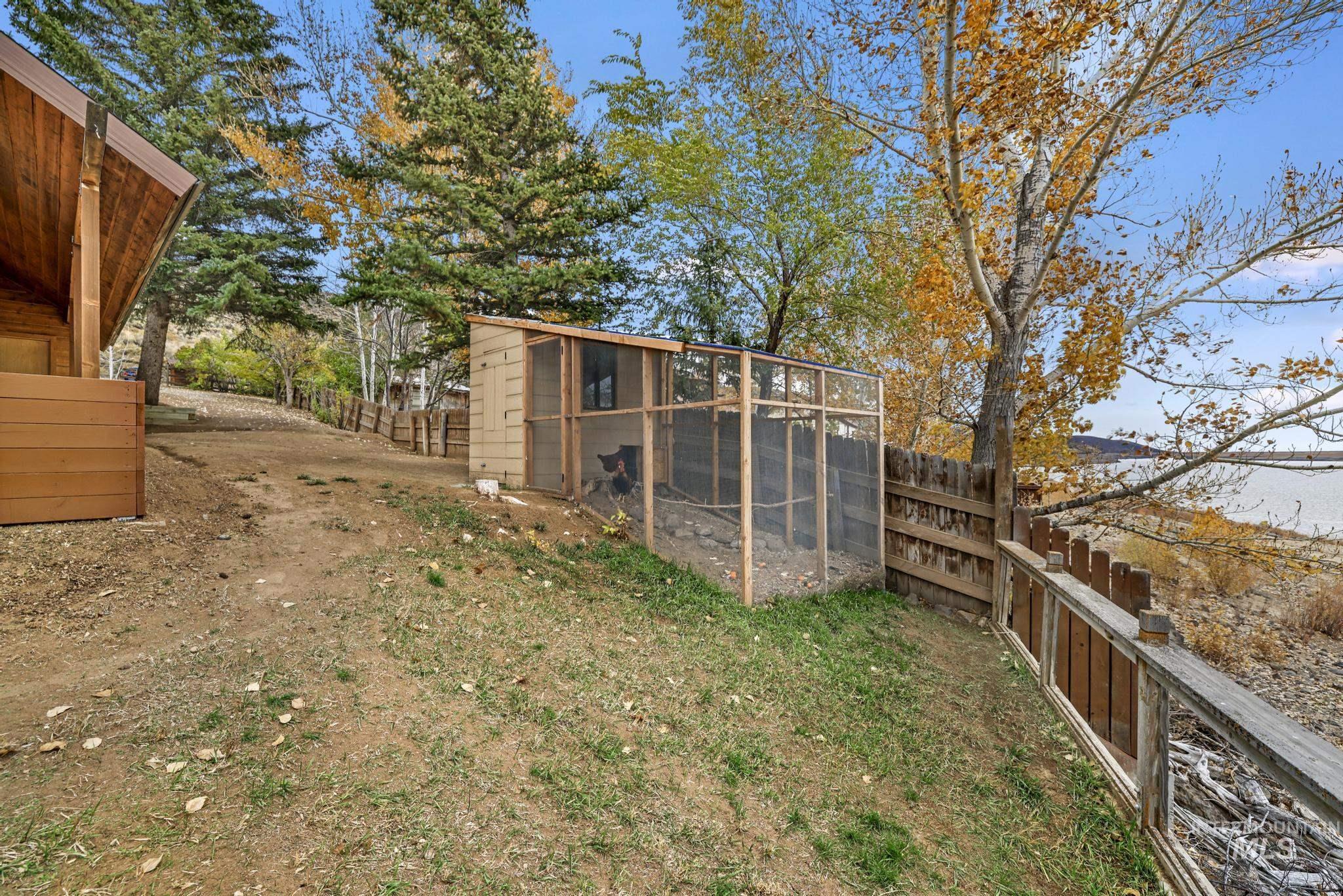 View of yard with exterior structure and an outbuilding