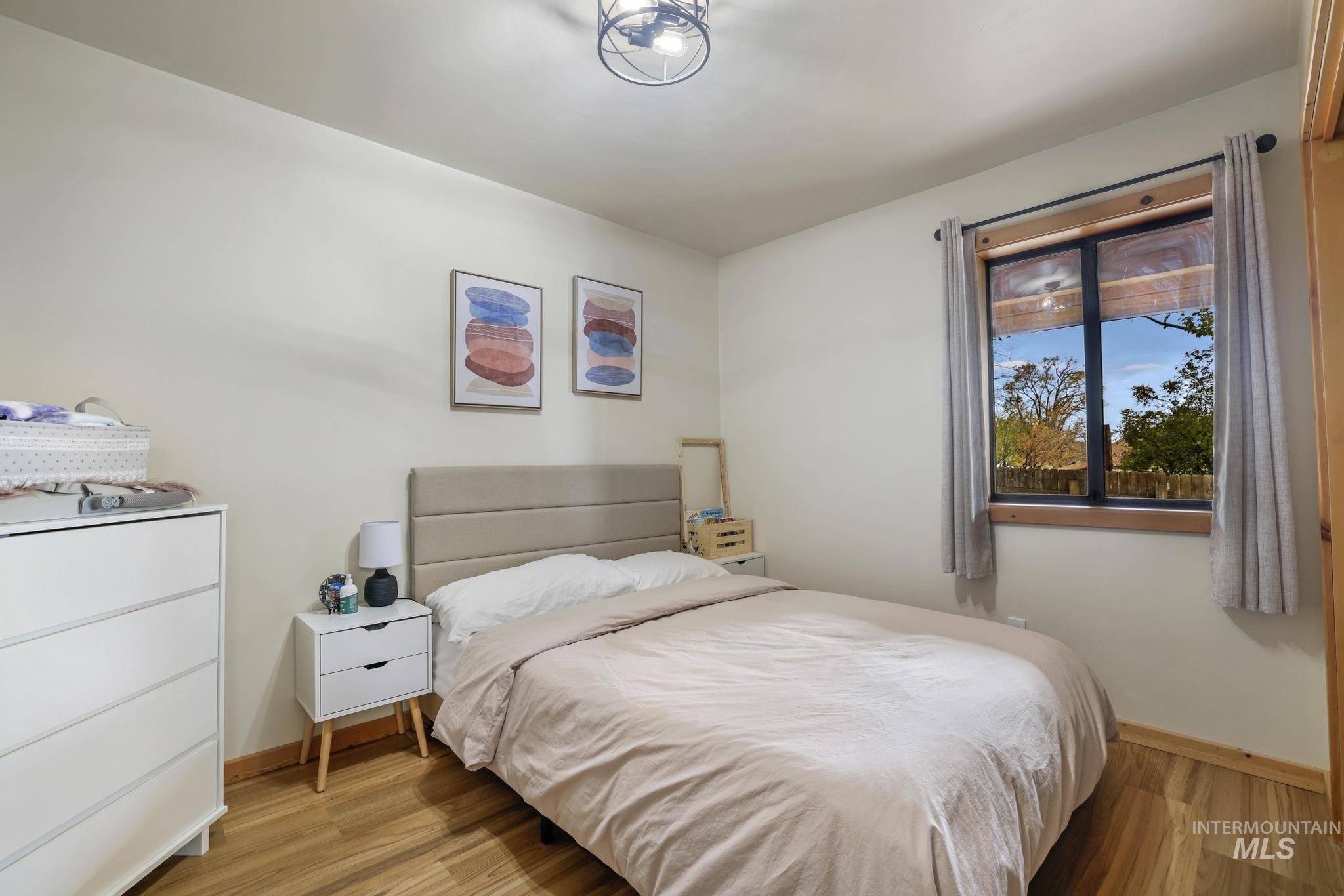 Bedroom with light wood finished floors